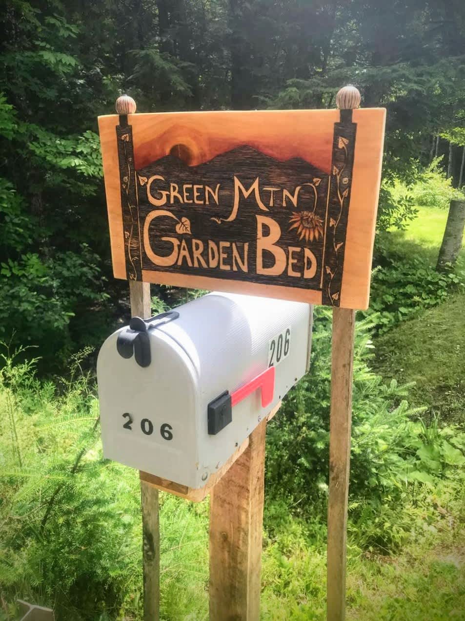 Follow the Green Mountain Garden Bed signs to your campsite!