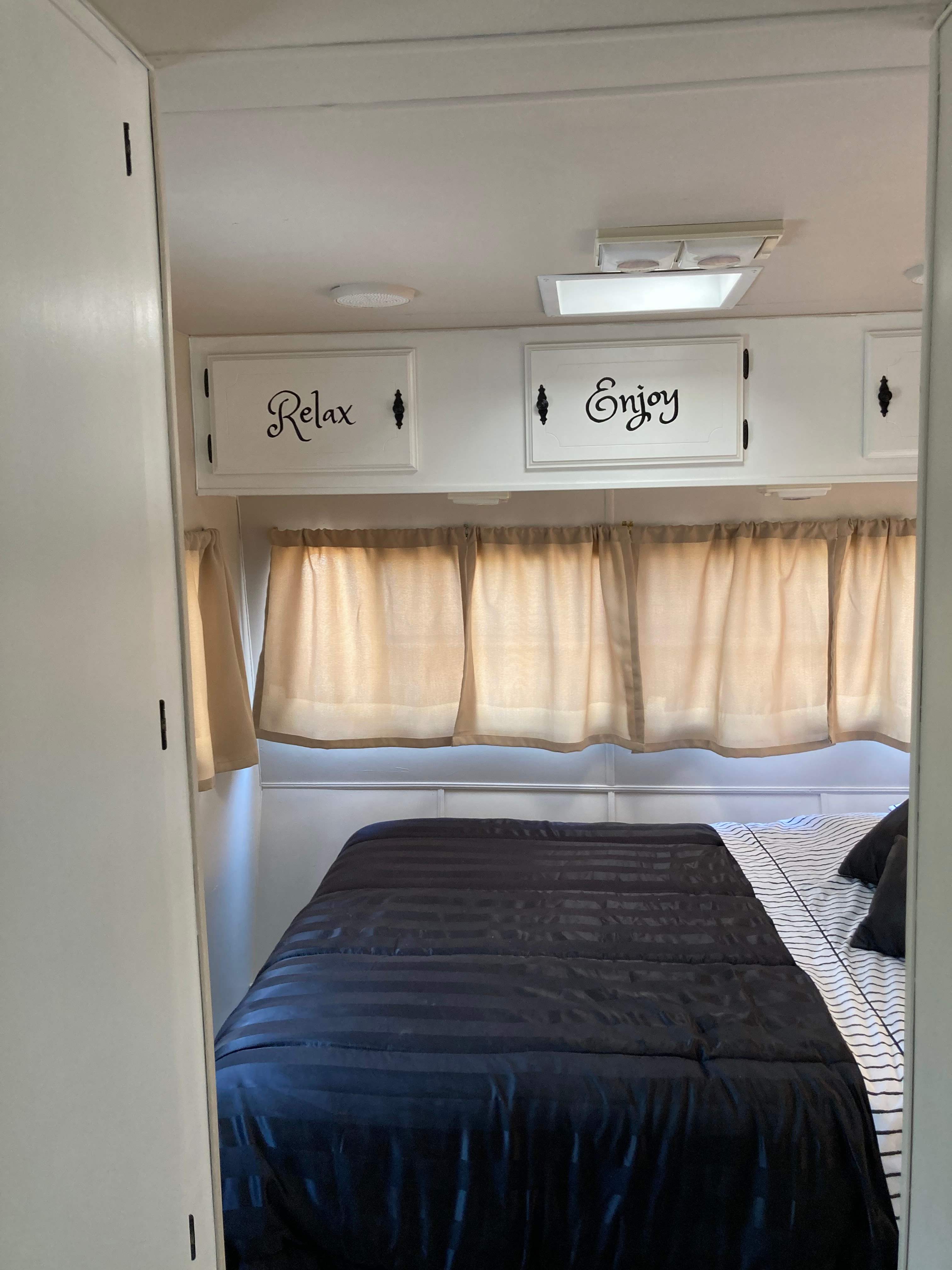 Queen size in the bedroom. Privacy curtain at entrance.