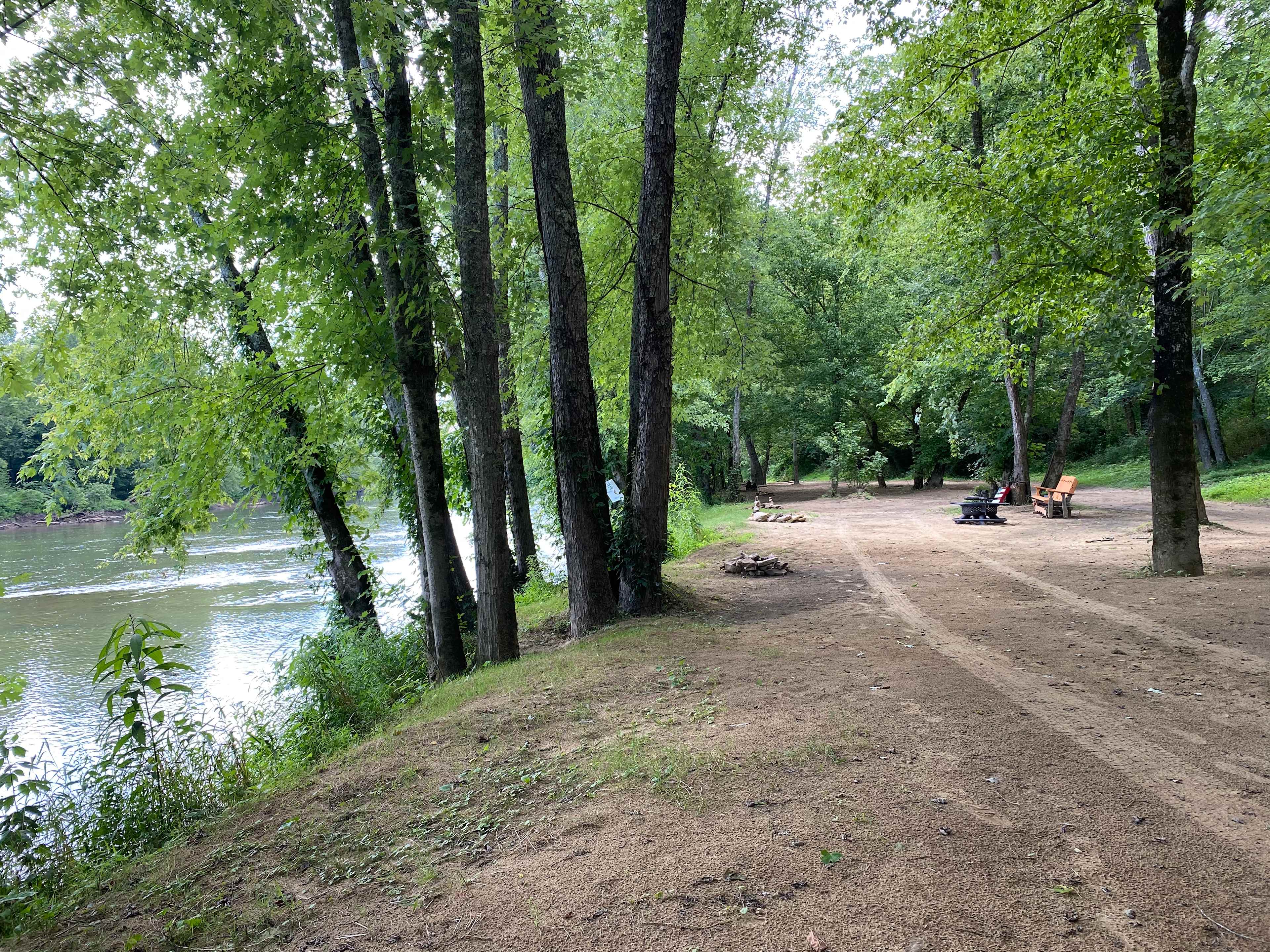 View down the riverbank overlooking campsites
Standing at Hammock hanger