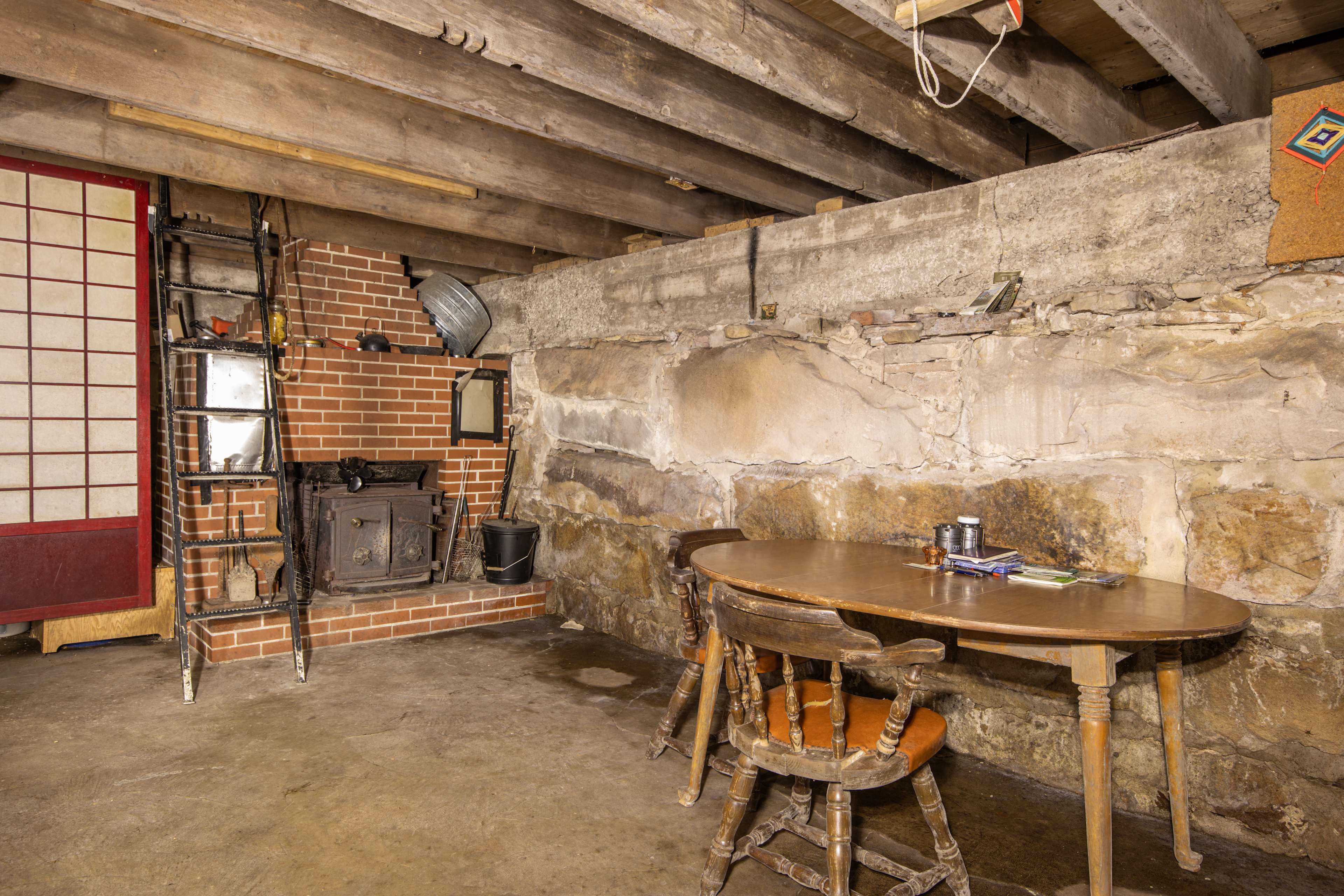 A wood stove and table provide a great space for card games!