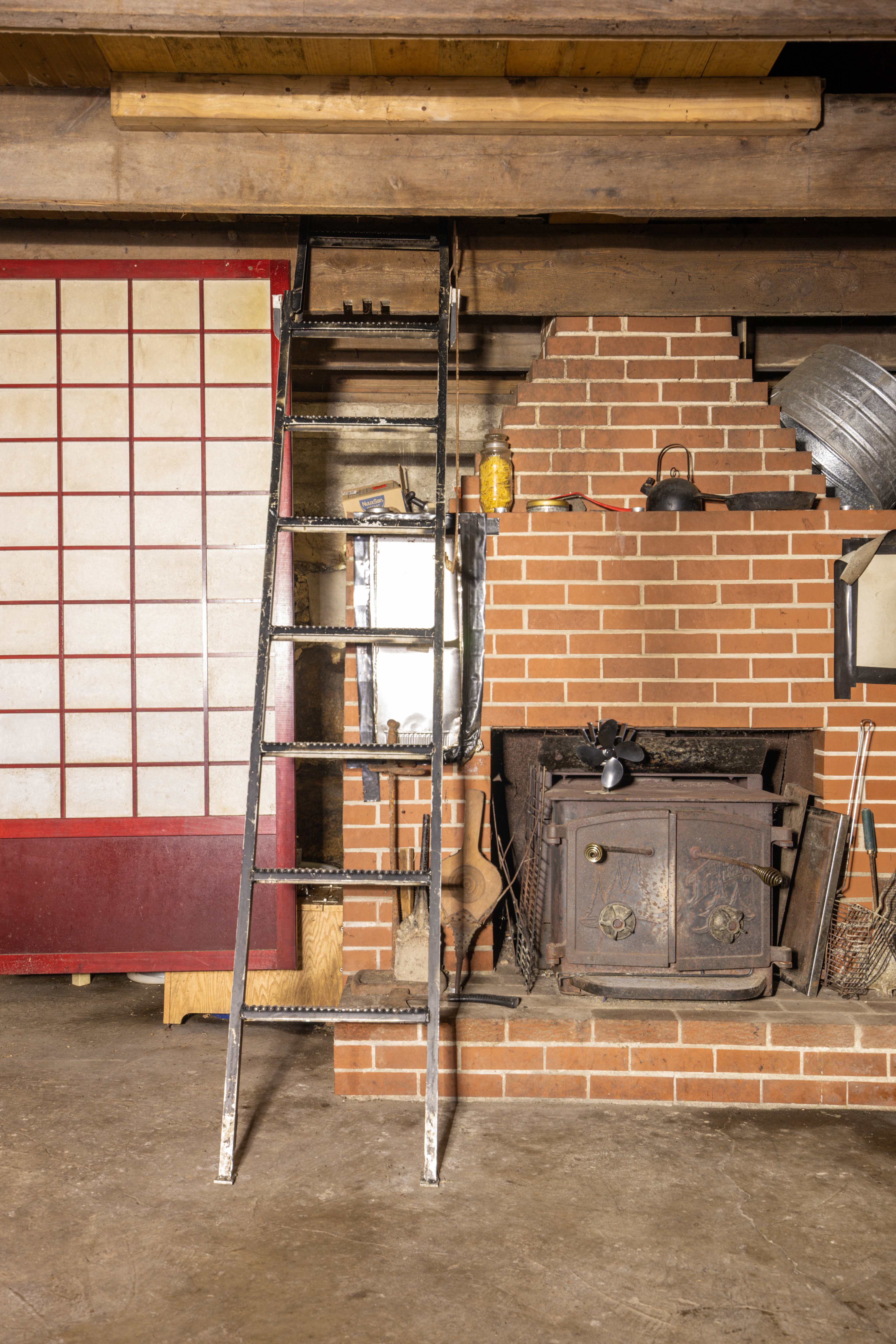 The sleeping area can be accessed via this cool old metal ladder.