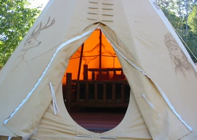 Looking inside the door of the Deer Tipi
