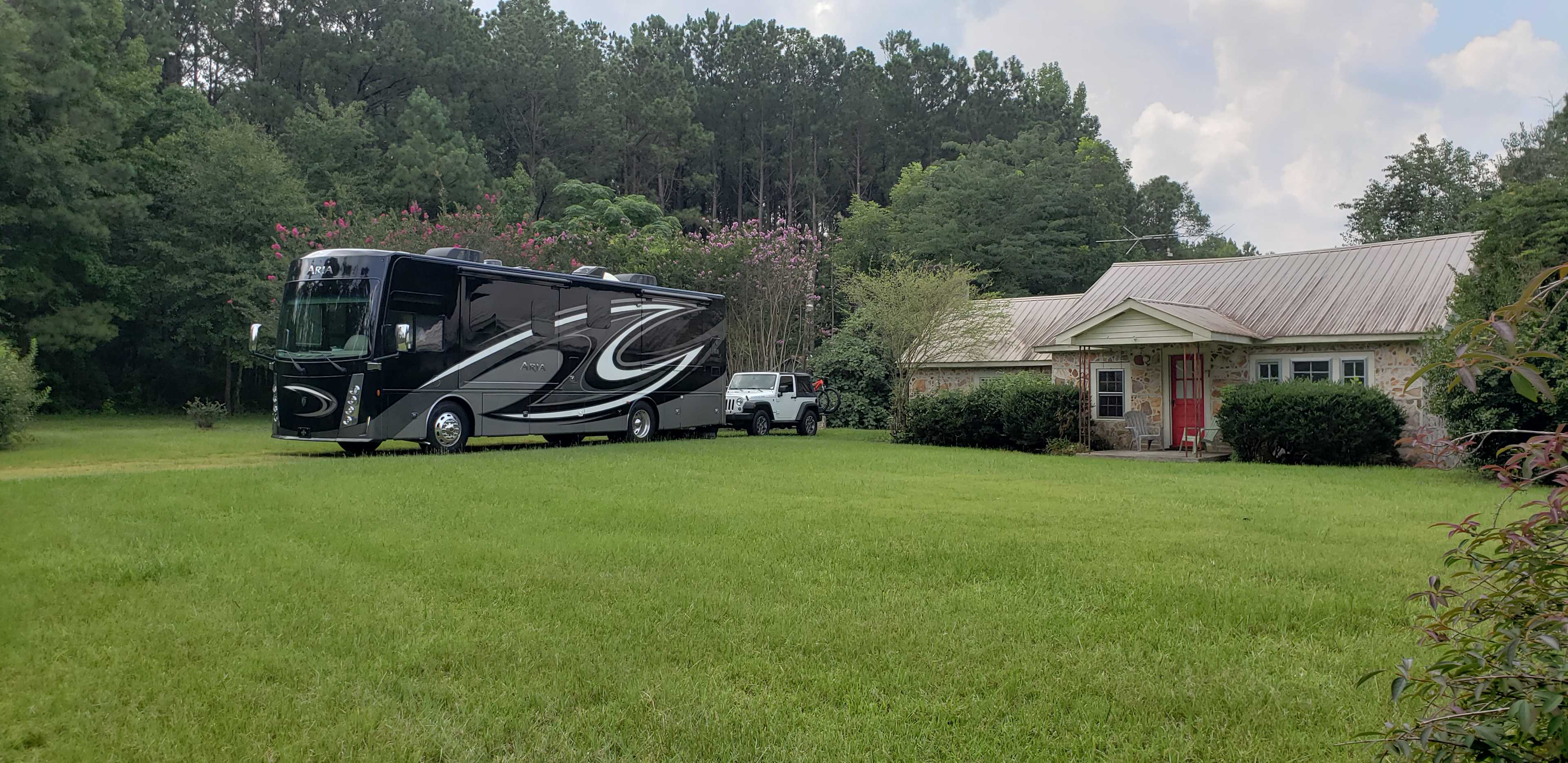 Photo taken from front yard of the vacant home; RV backs in off paved (rarely traveled) road; home is not to be accessed - Keep Out. 