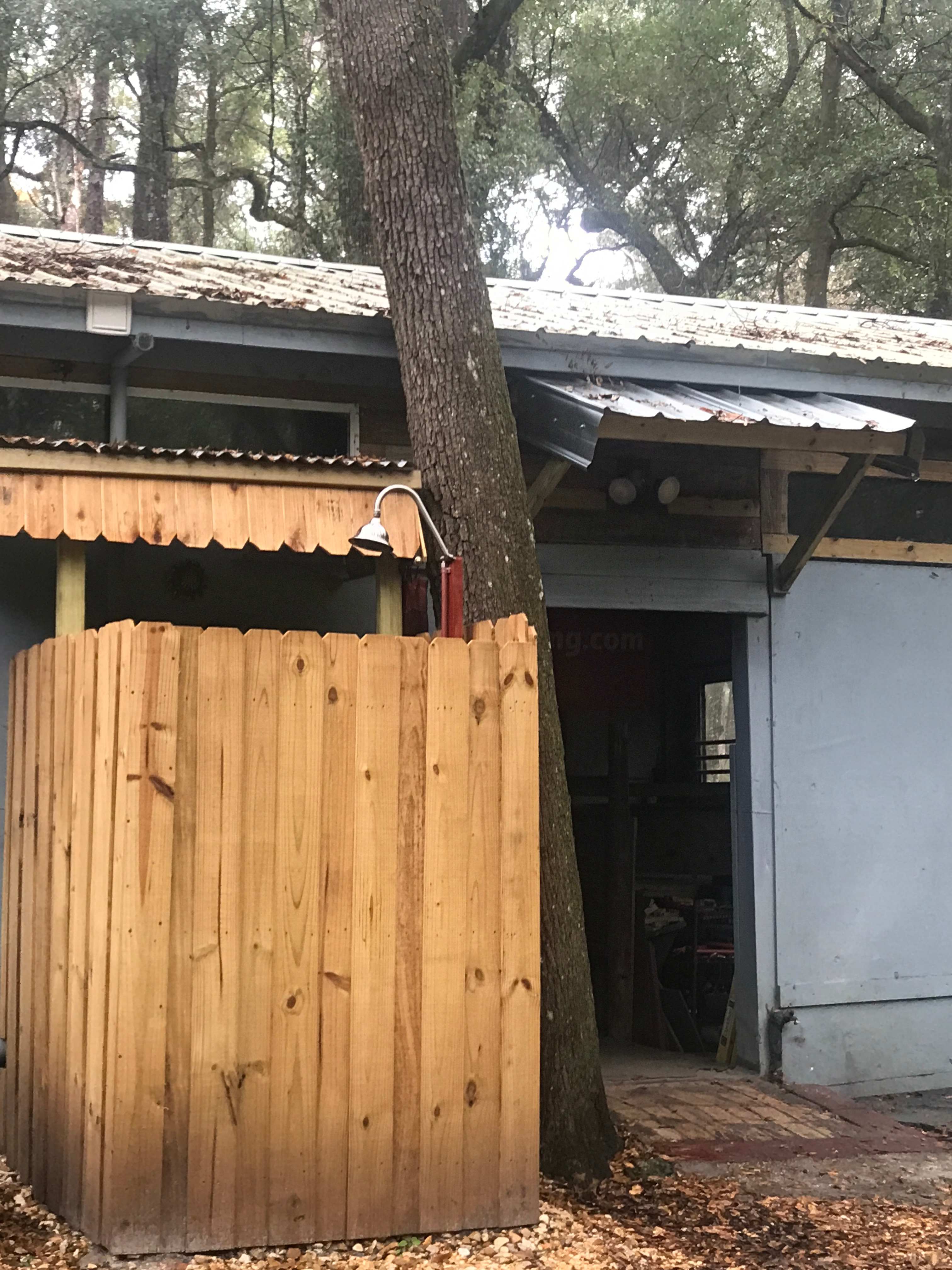 Indoor bathroom with outdoor heated shower. 