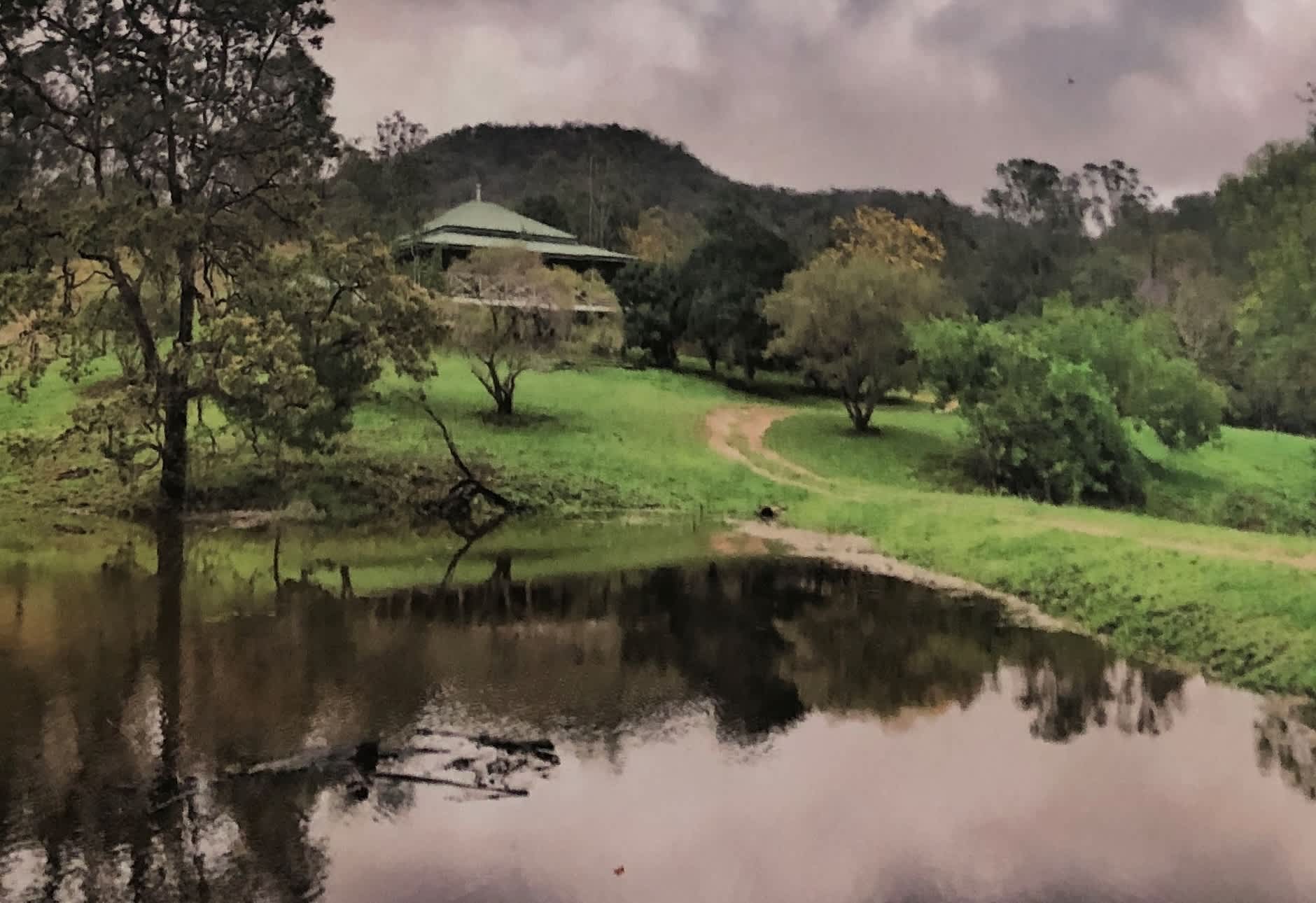 The farm house,  your camp is through another gate in the valley beyond.