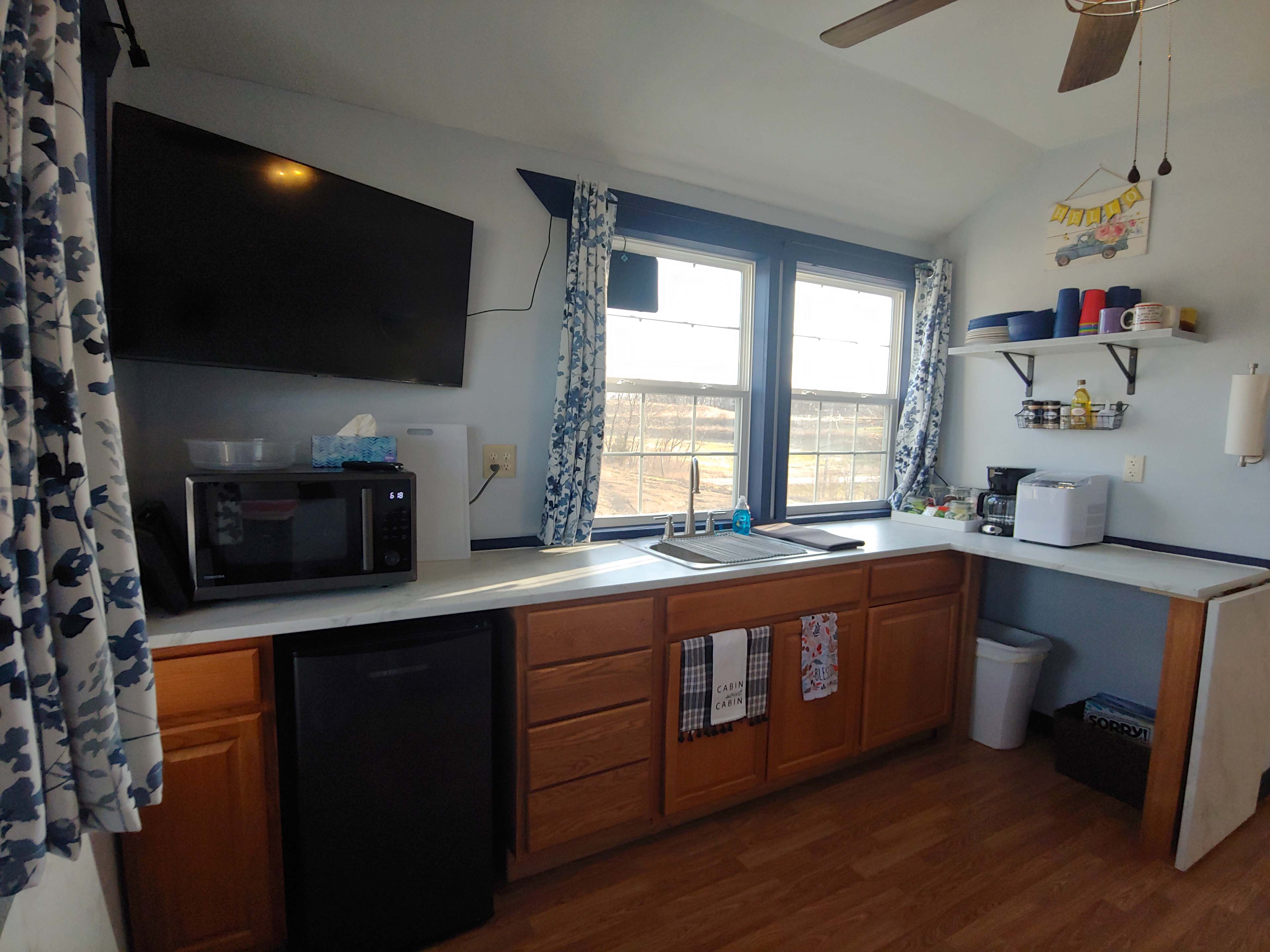 43 inch TV with antenna, microwave/air fryer/convection oven combo, mini fridge, coffee pot and ice maker