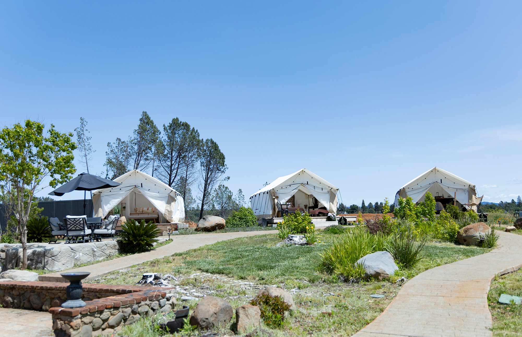 From left to right: Paradise Arts tent, Glam tent, and Speakeasy tent