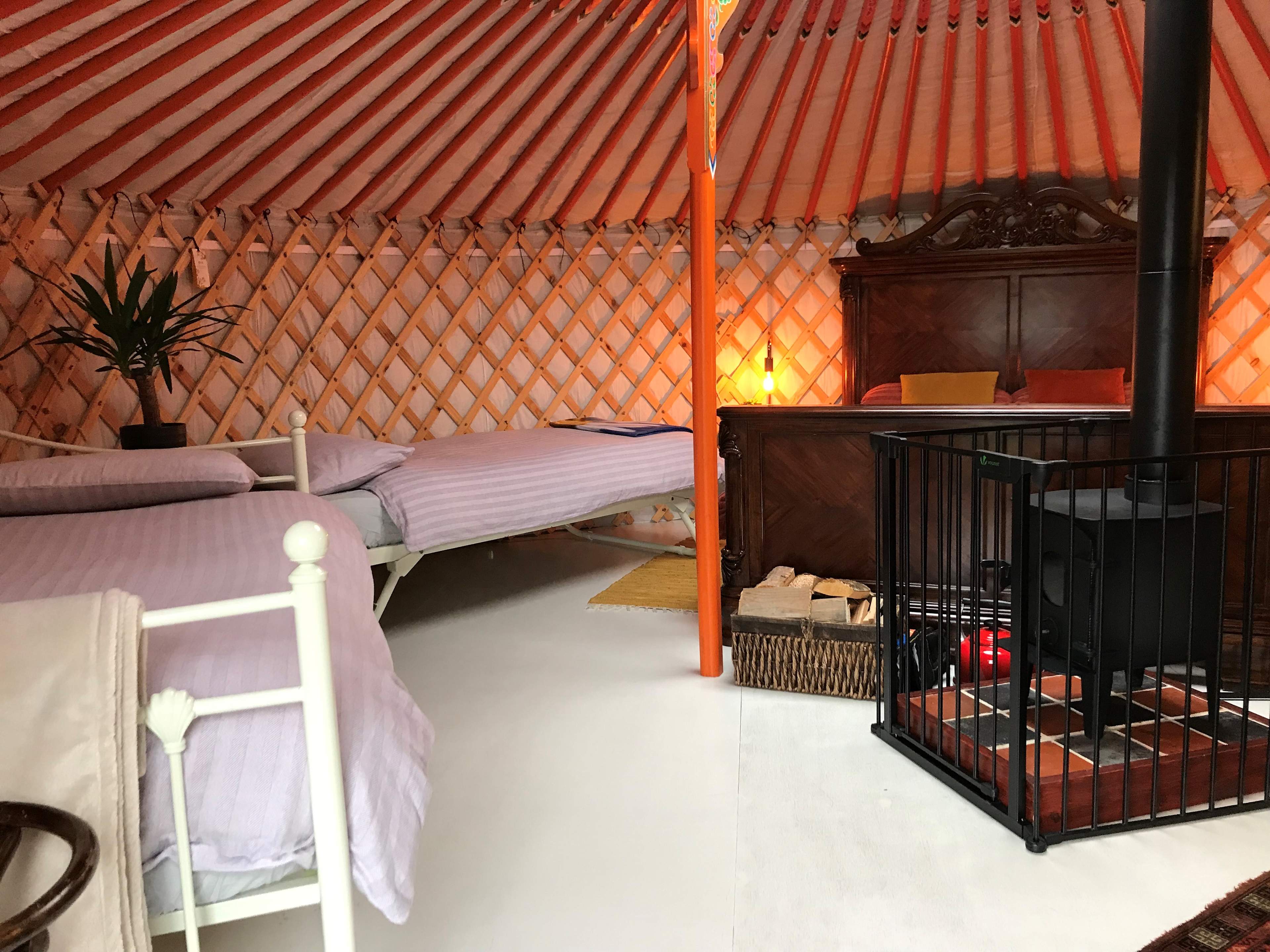 Yurt set up for 4 guests - kingsize bed plus two single beds