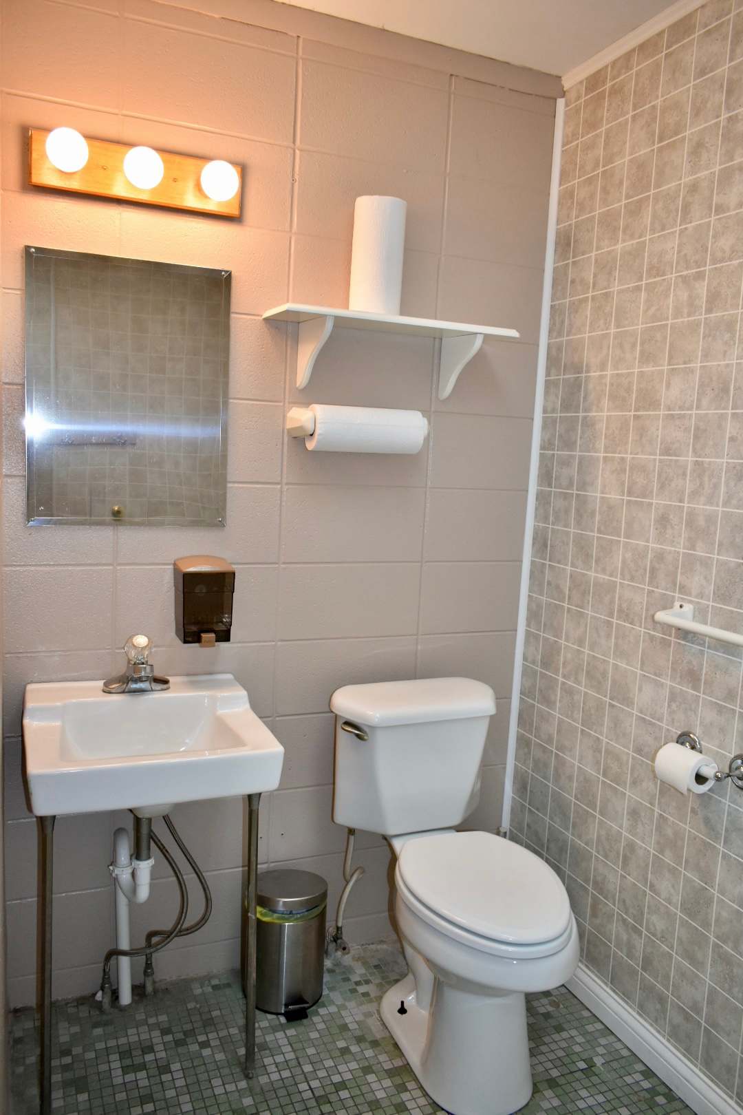 Complete restroom facilities including two toilets and two showers