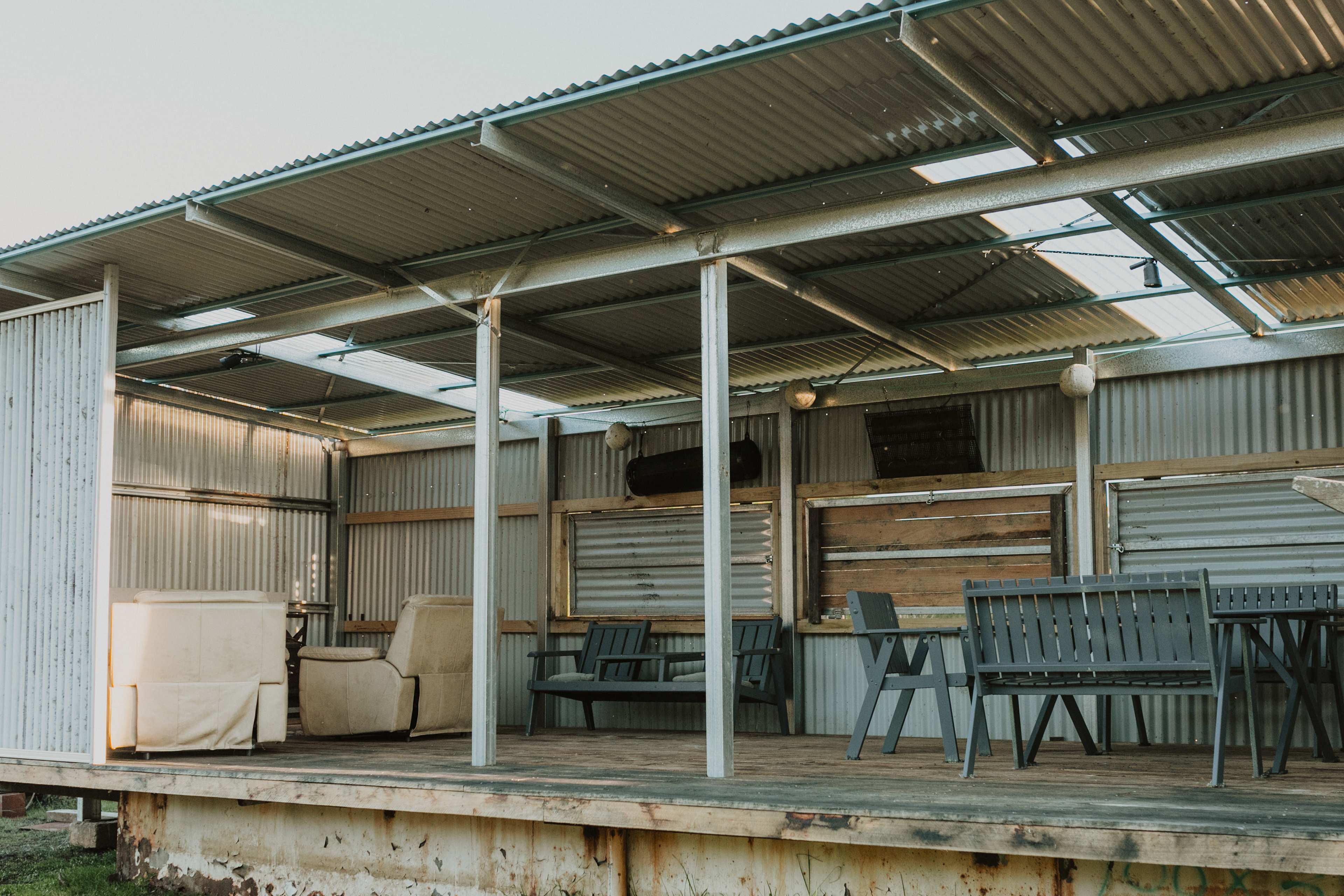 The shed where you can relax, sit around the table, enjoy a fire, play some darts...