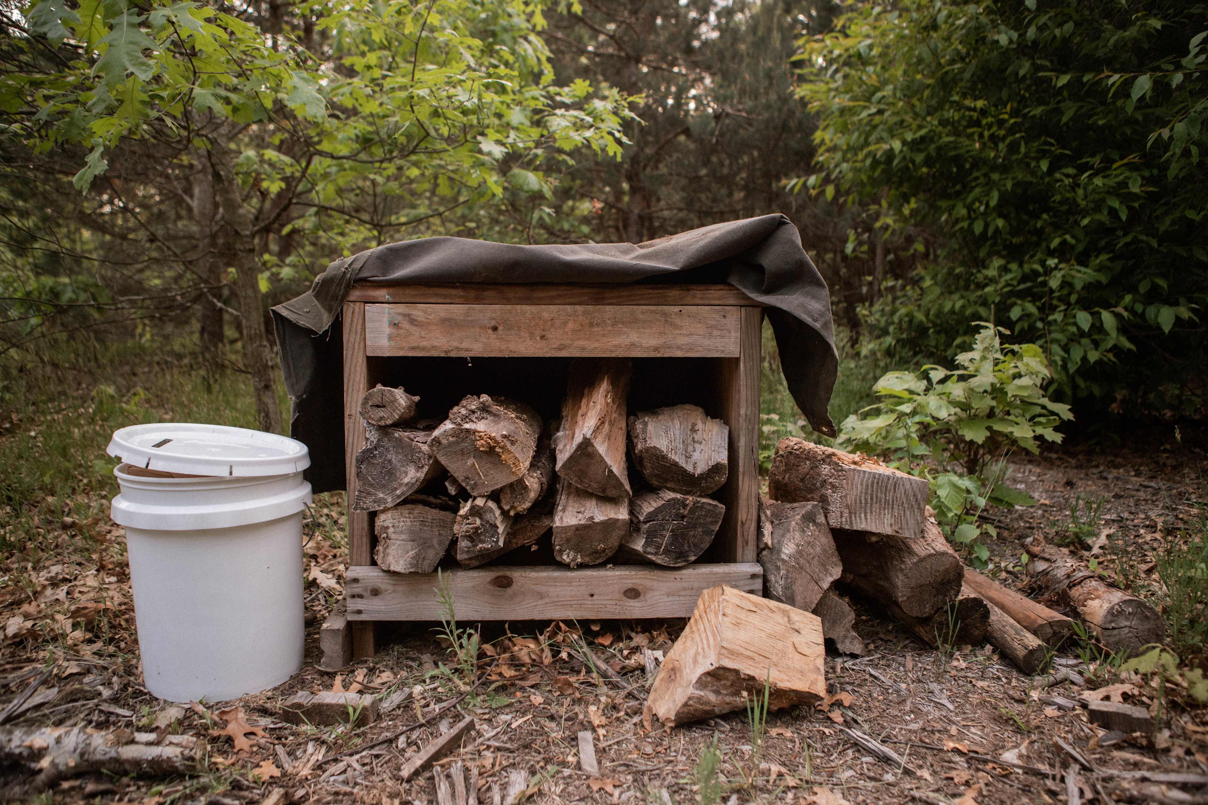 The firewood is kept safe and dry in this covered structure!