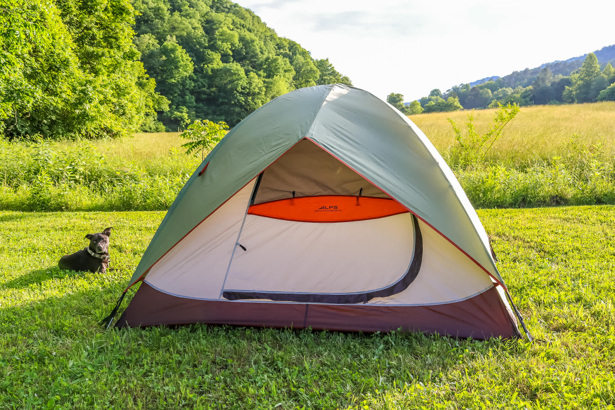 The tent with mountains behind