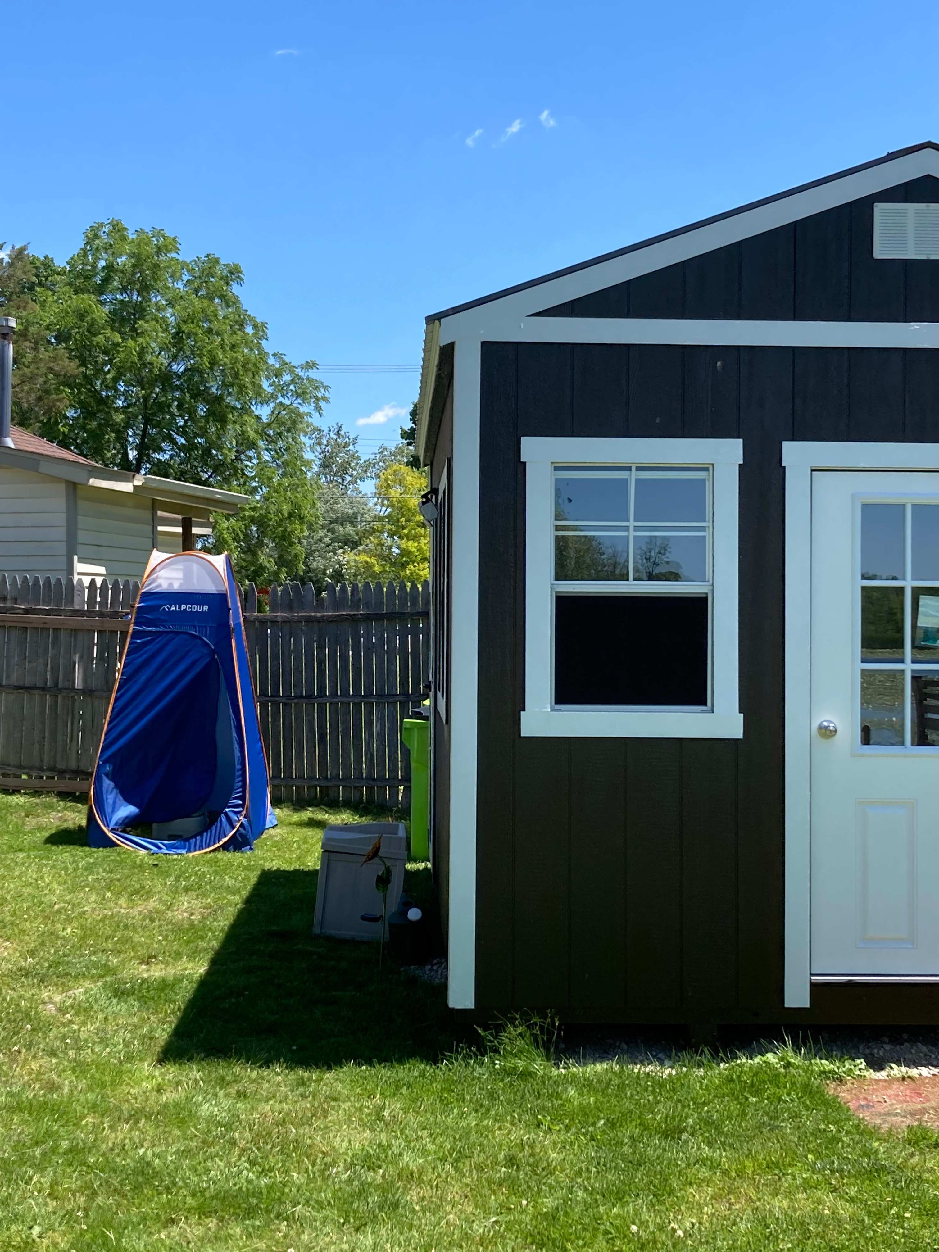 Pop-up with portable and flushing camping toilet.