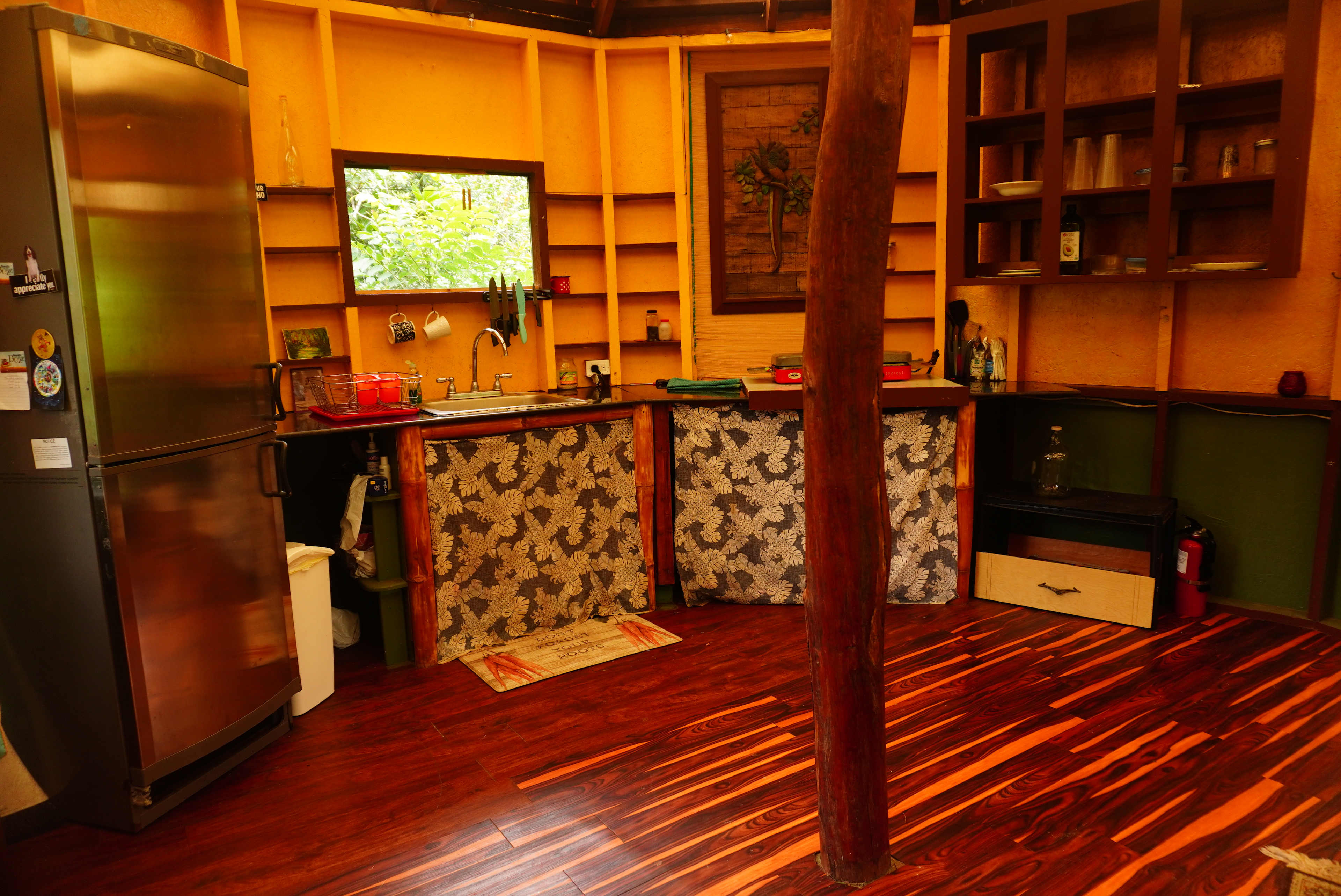 Kitchen with 2 burner gas stove, sink, and fridge for you to cook meals in