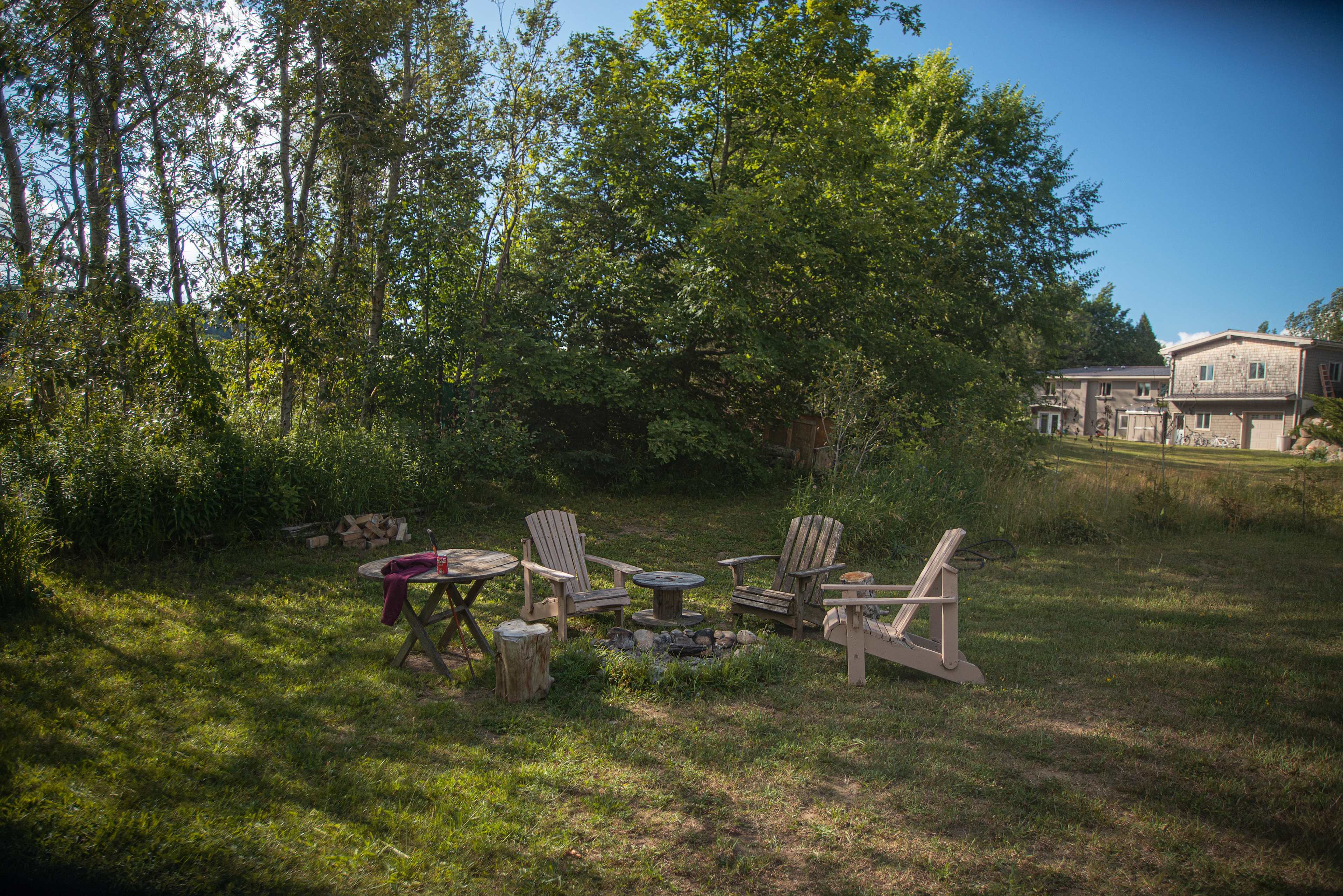 Fire pit area with view of house in the distance.