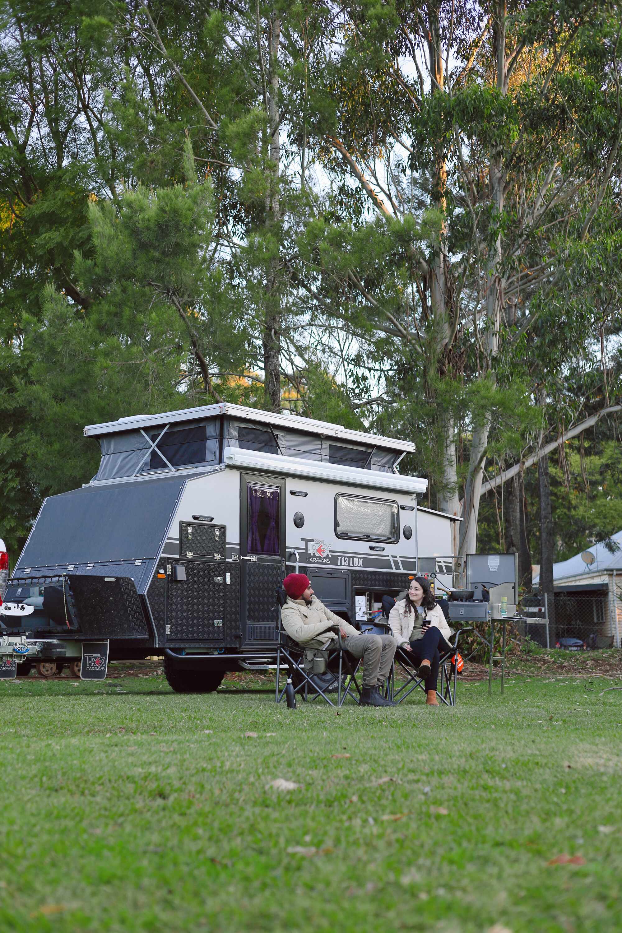 The campsite is leafy with manicured lawns and gardens.