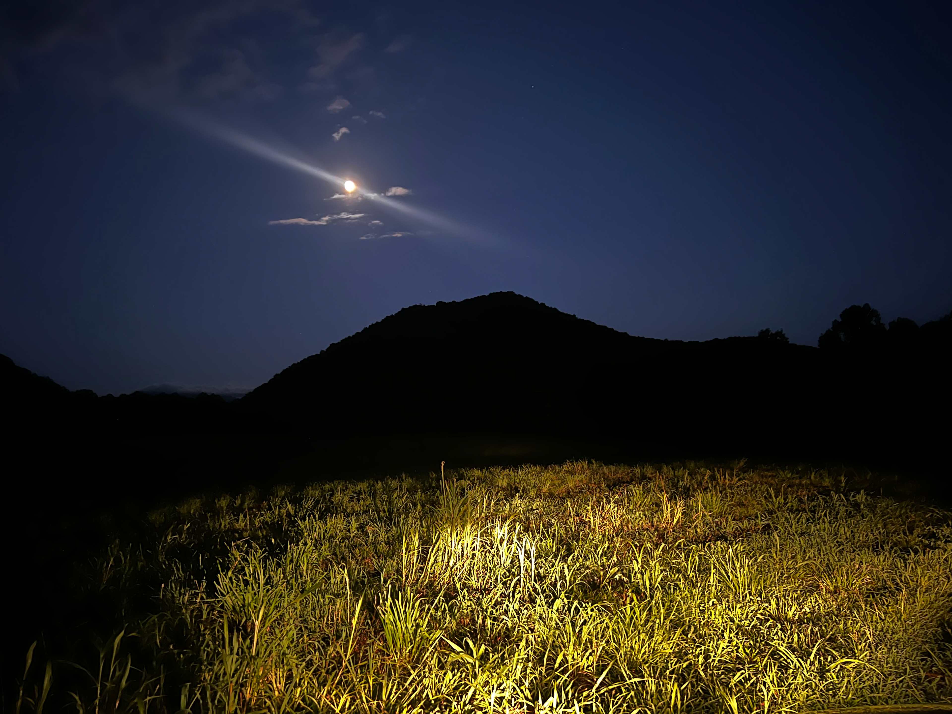 Night view of Sugarloaf Mountain as you drive across the property and down to your site by the river.