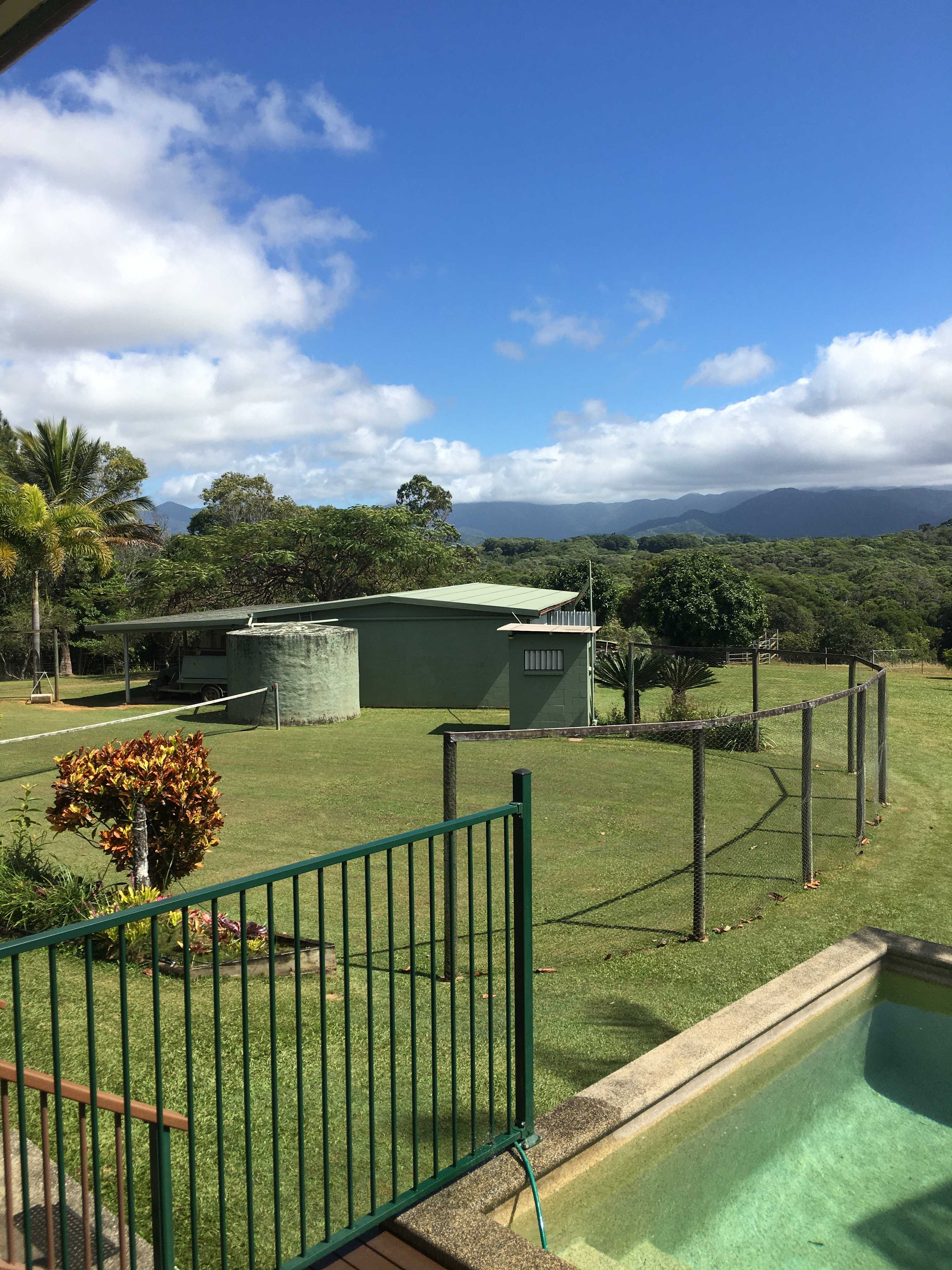 Grass tennis court & outdoor loo.