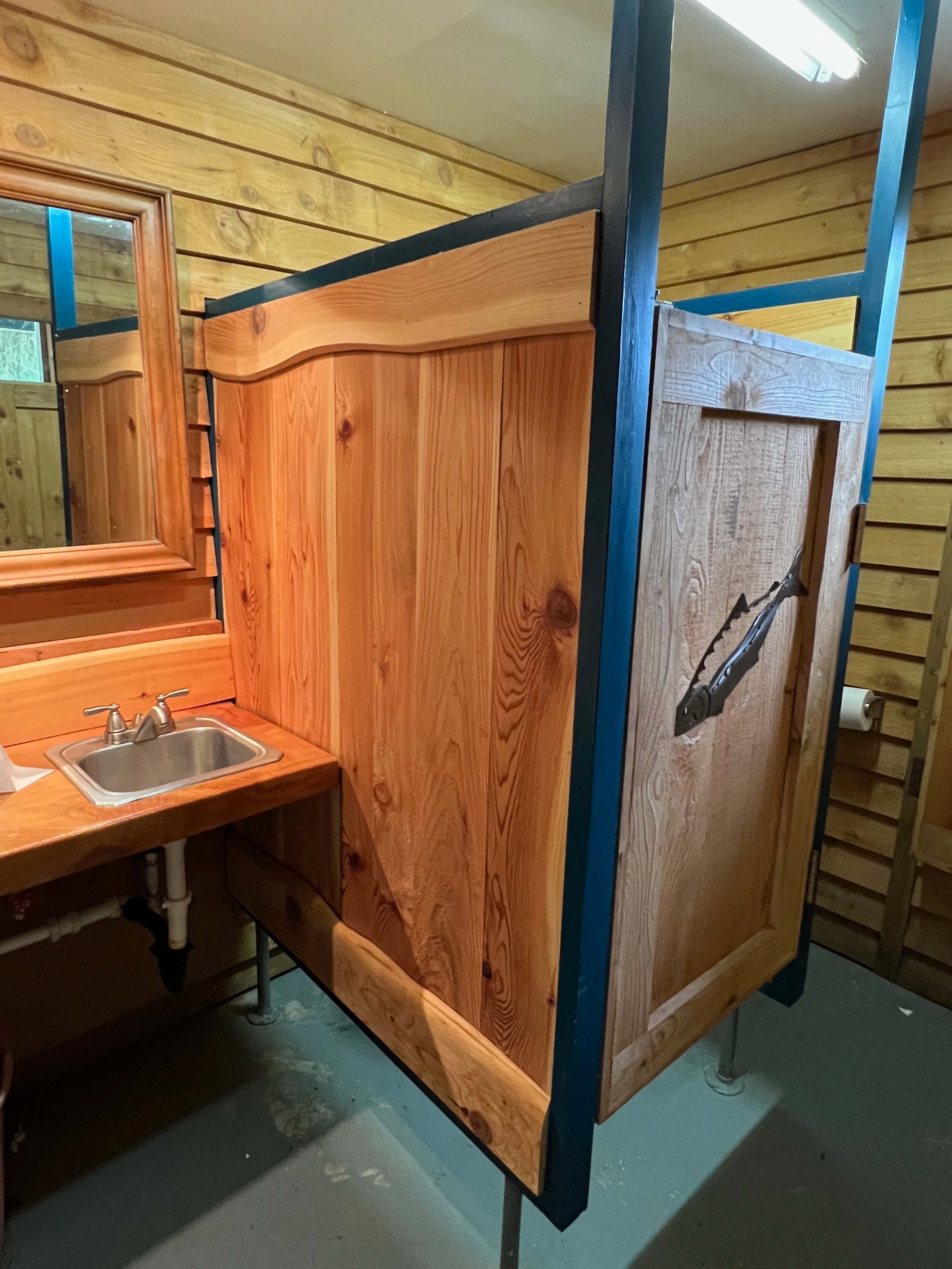 Flushing toilets and a sink.