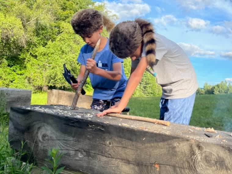 Some very resourceful young campers, hard at work exploring and experiencing the great outdoors.
