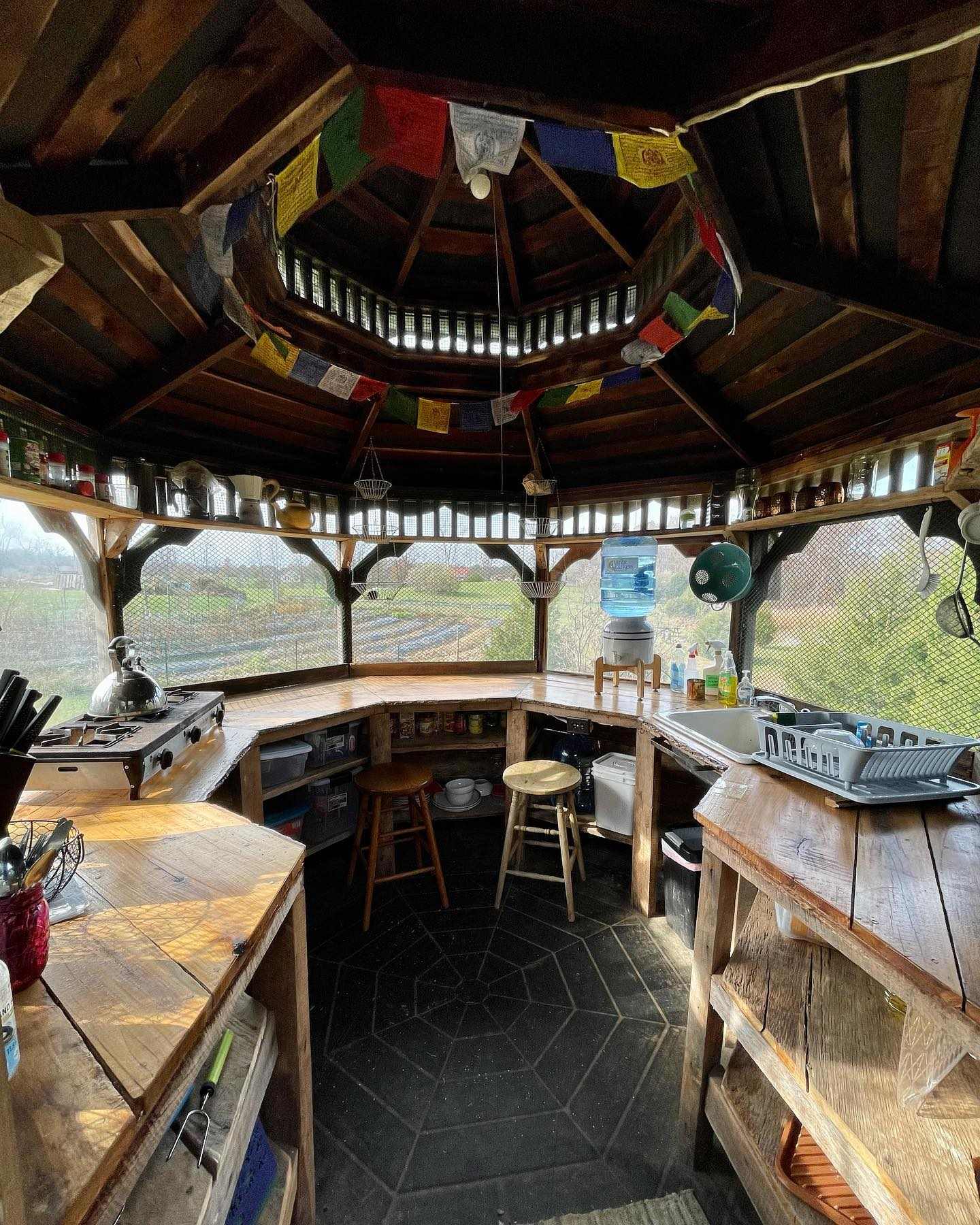The screened gazebo kitchen is a lovely place to prepare a meal and is stocked with just about everything you'd need.  