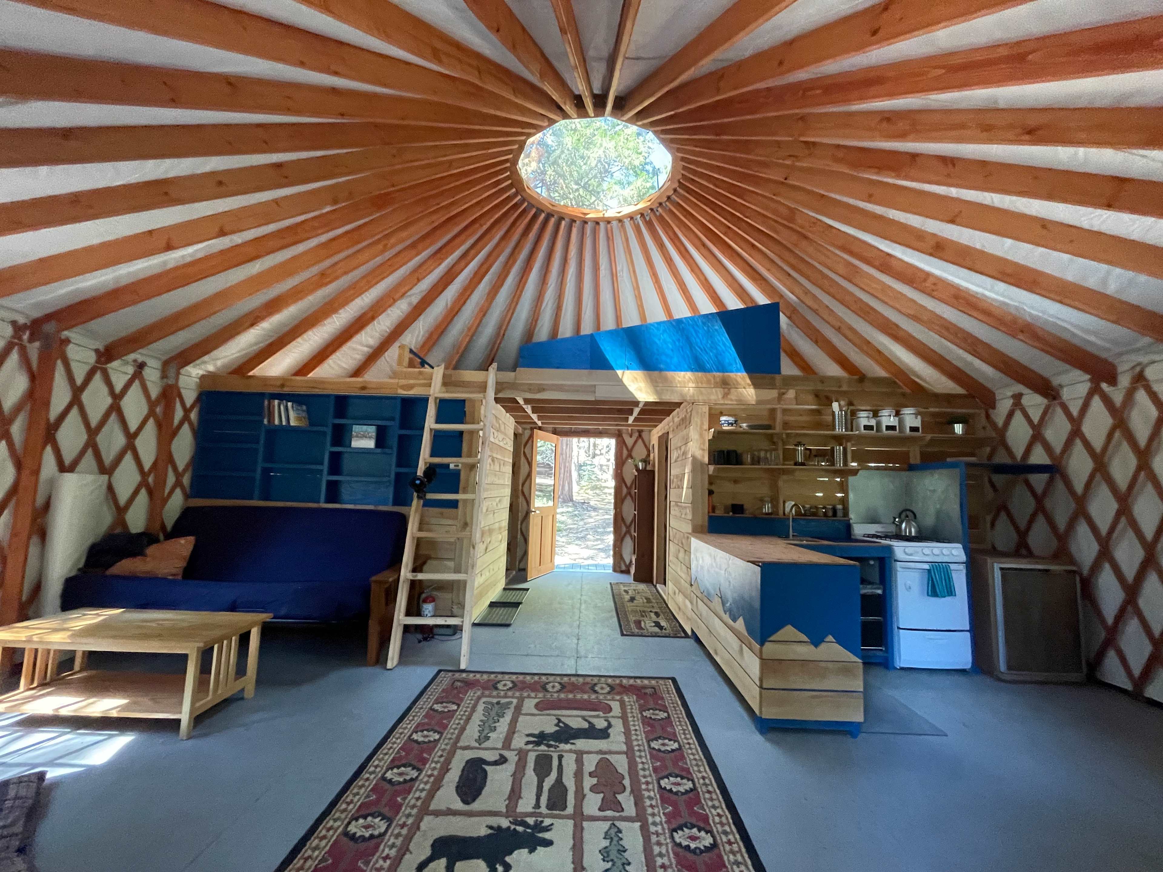 Very spacious 24' yurt with a full kitchen, solar powered electricity, a loft bedroom and a futon for extra guests.