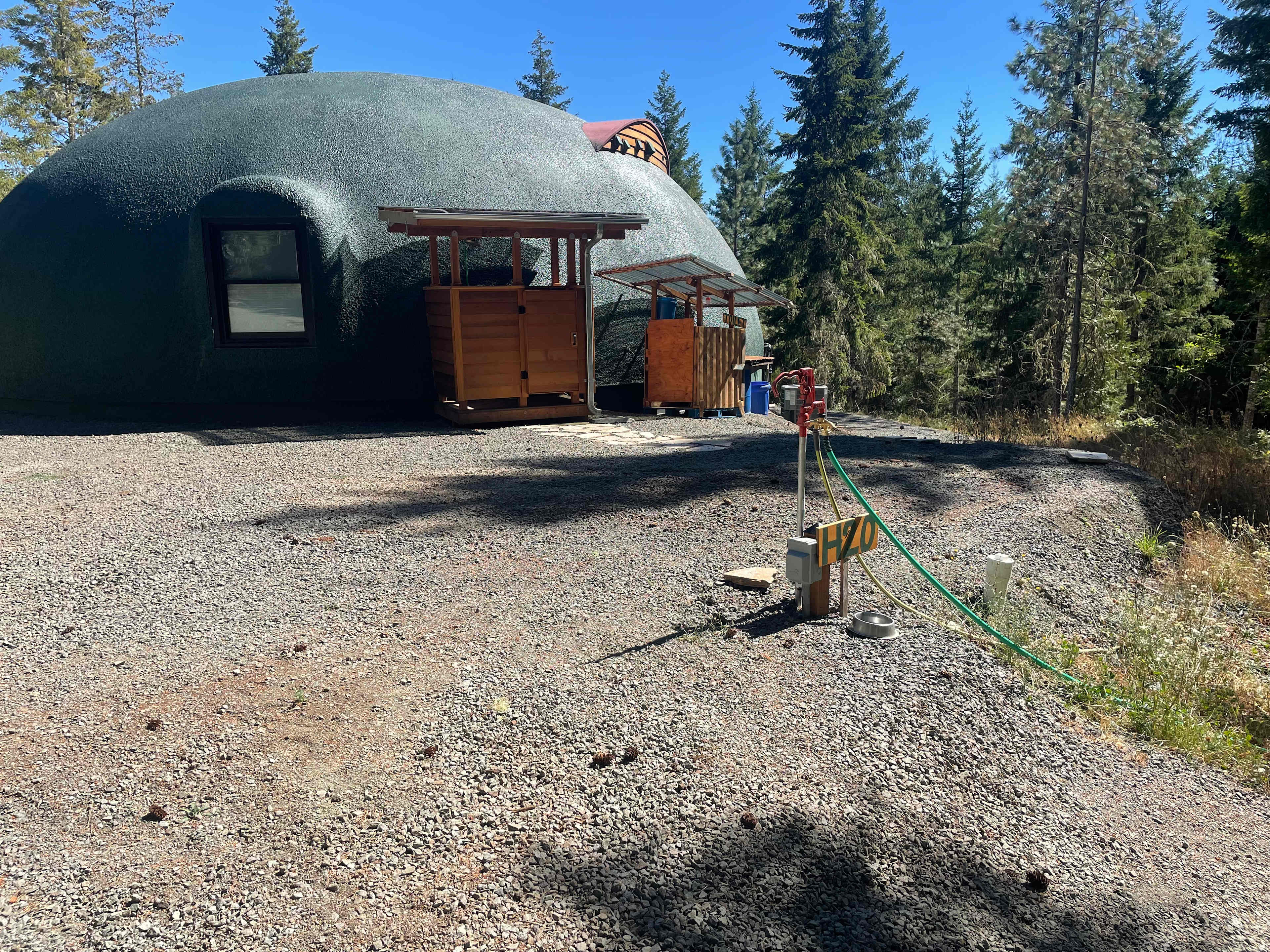 Pad parking, outdoor shower, composting toilet, water and electric hookup, no sewage. 
