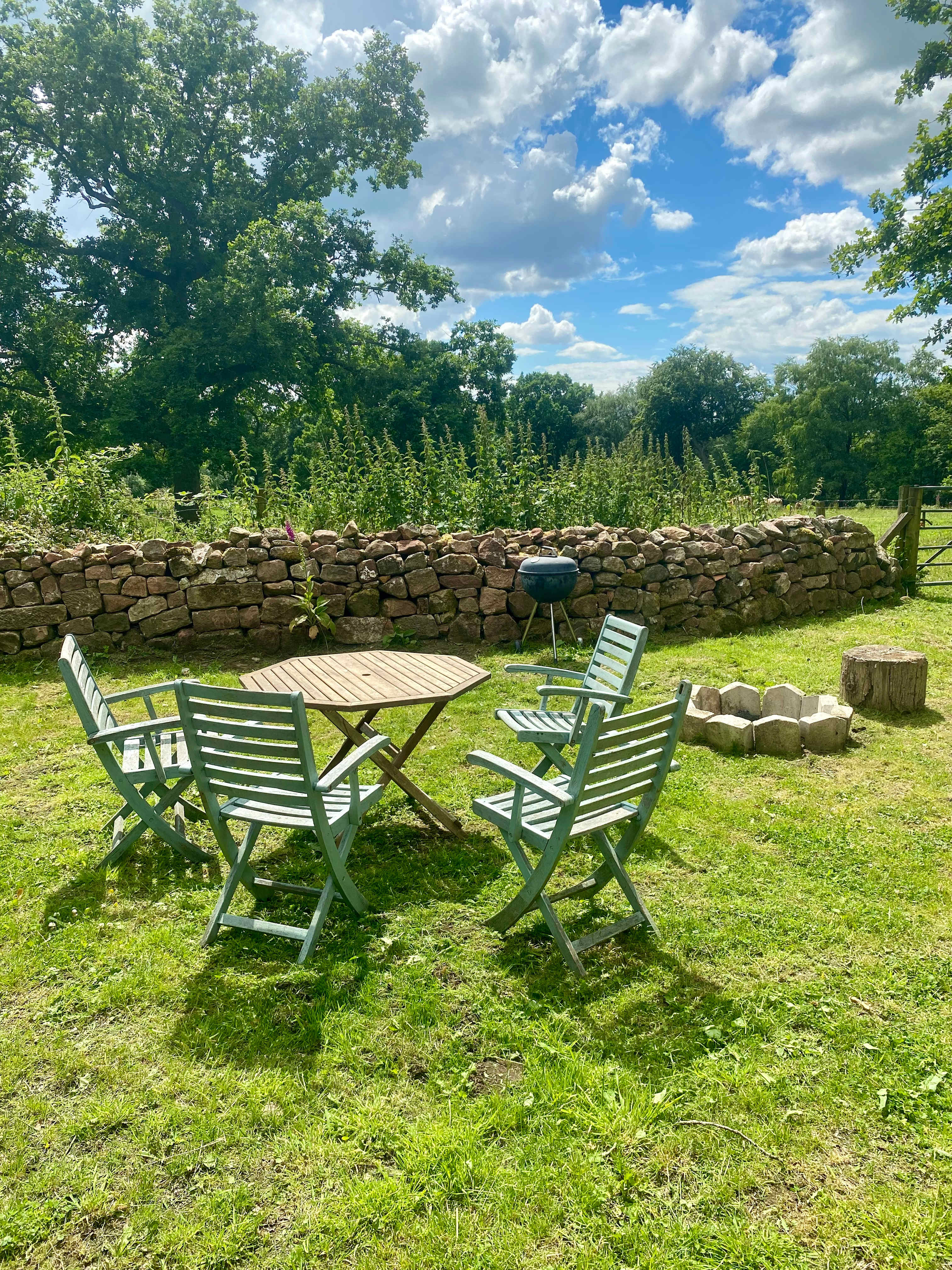 Our outdoor seating area complete with fire pit for toasting marshmallows by and the barbecue for those alfresco meals.