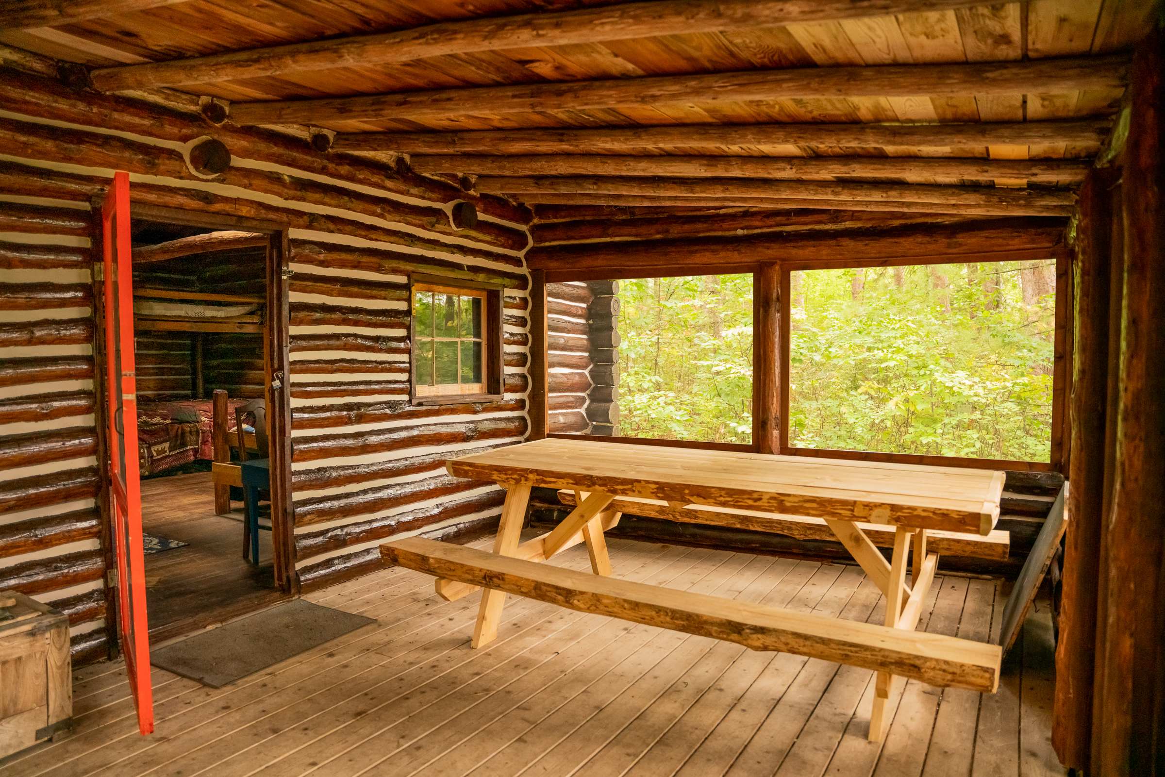 The screened in porch is a great spot to hang out and has it's own large picnic table. The perfect place to share a meal with friends.