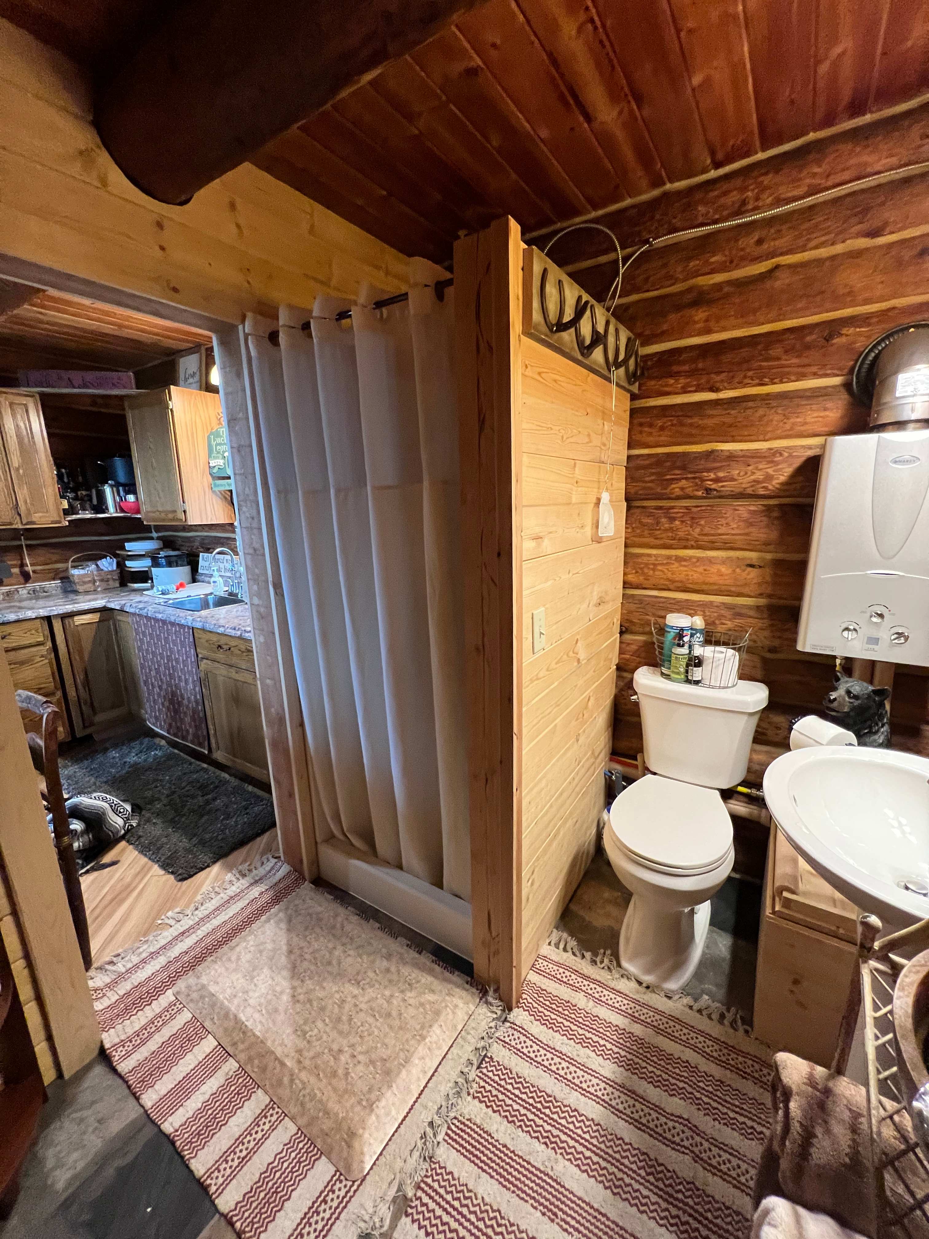 Shower with hot water on demand. Please conserve water as cabin is on a cistern and we have to haul water up the mountain.