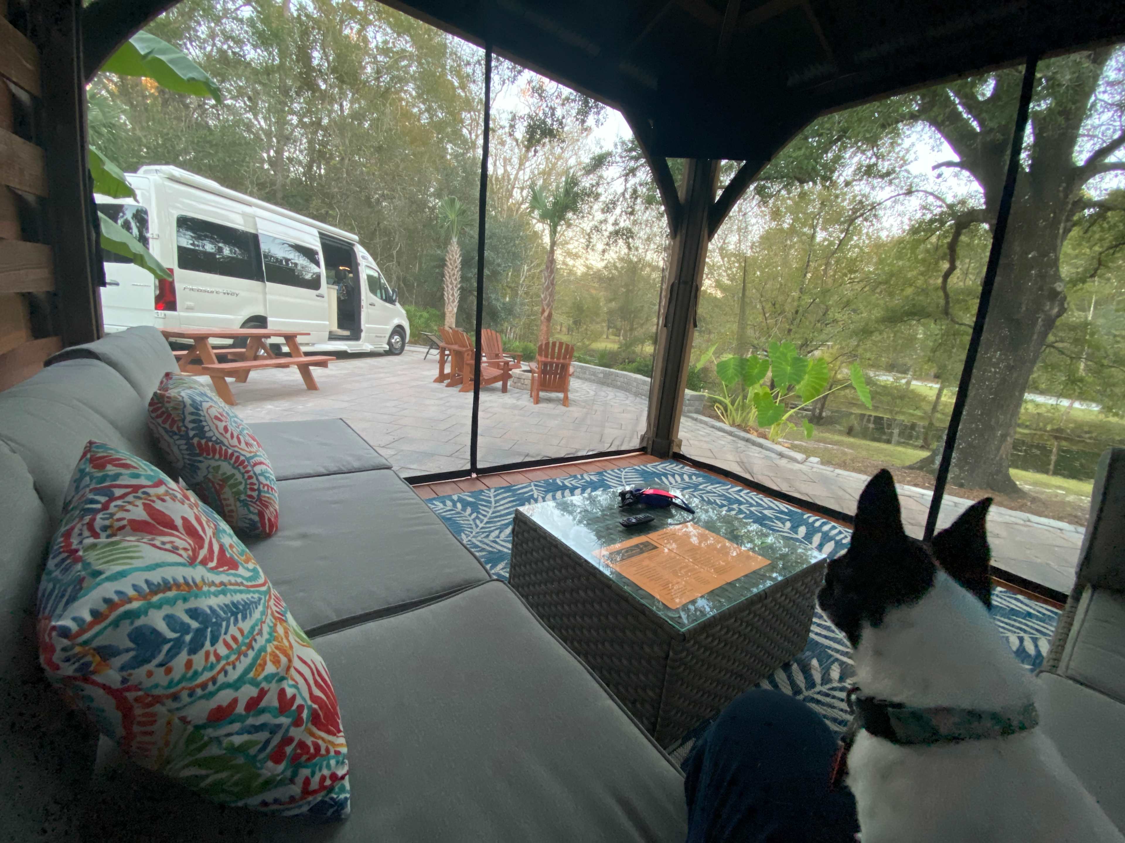 Gorgeous screened lanai with L shaped sofa and tv!