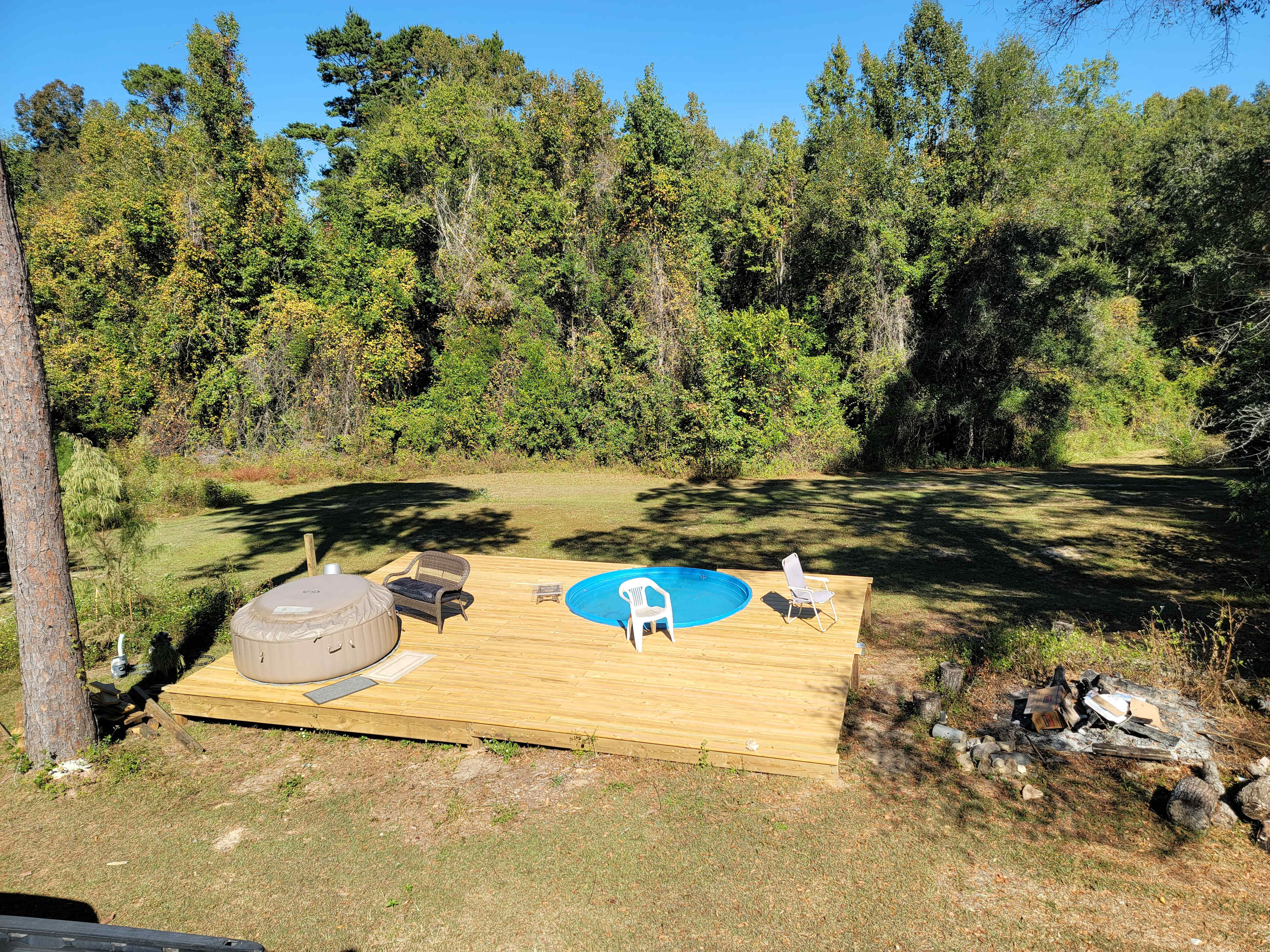 Hot tub and seasonal stock tank pool.