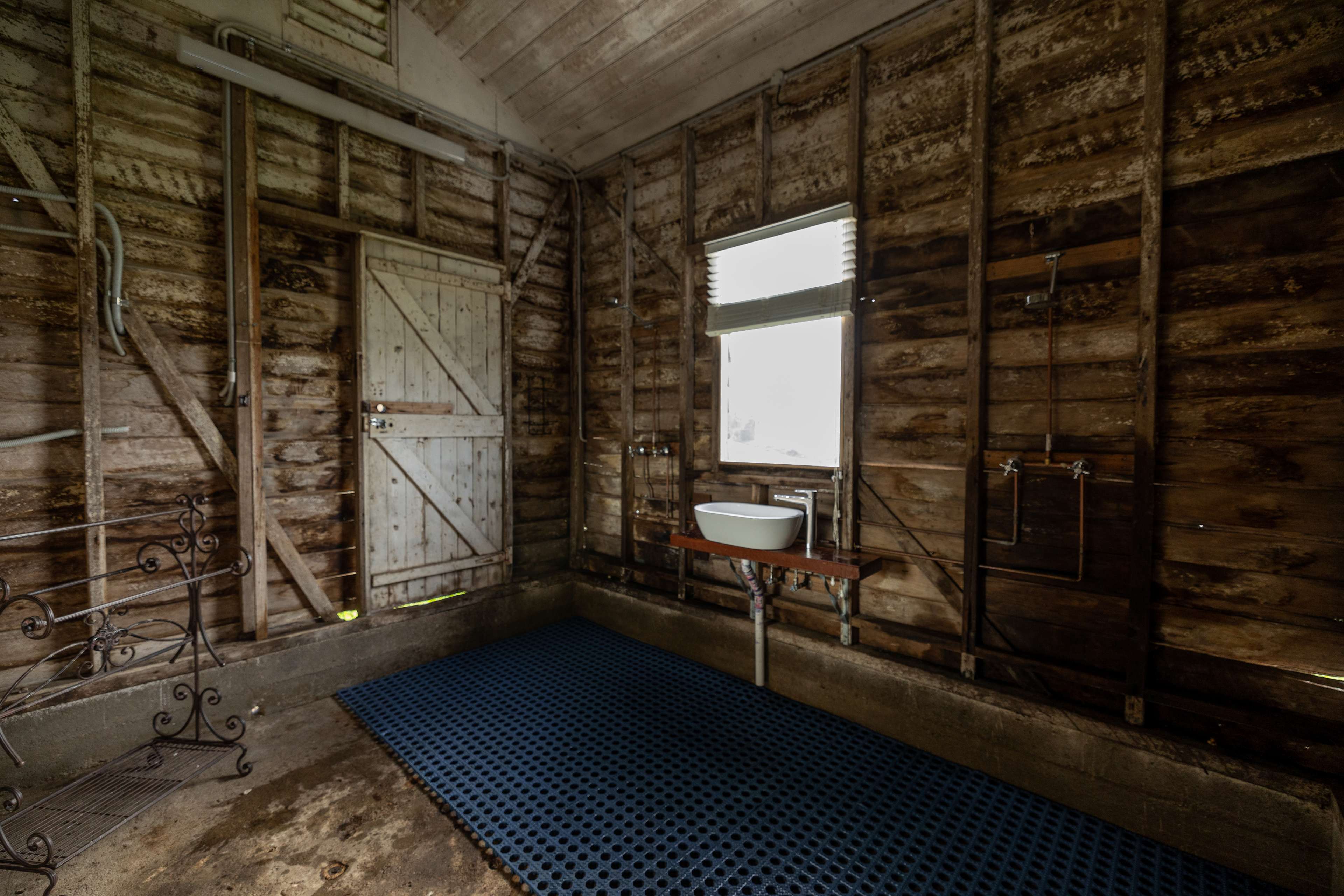 Indoor bathroom with 2 showers