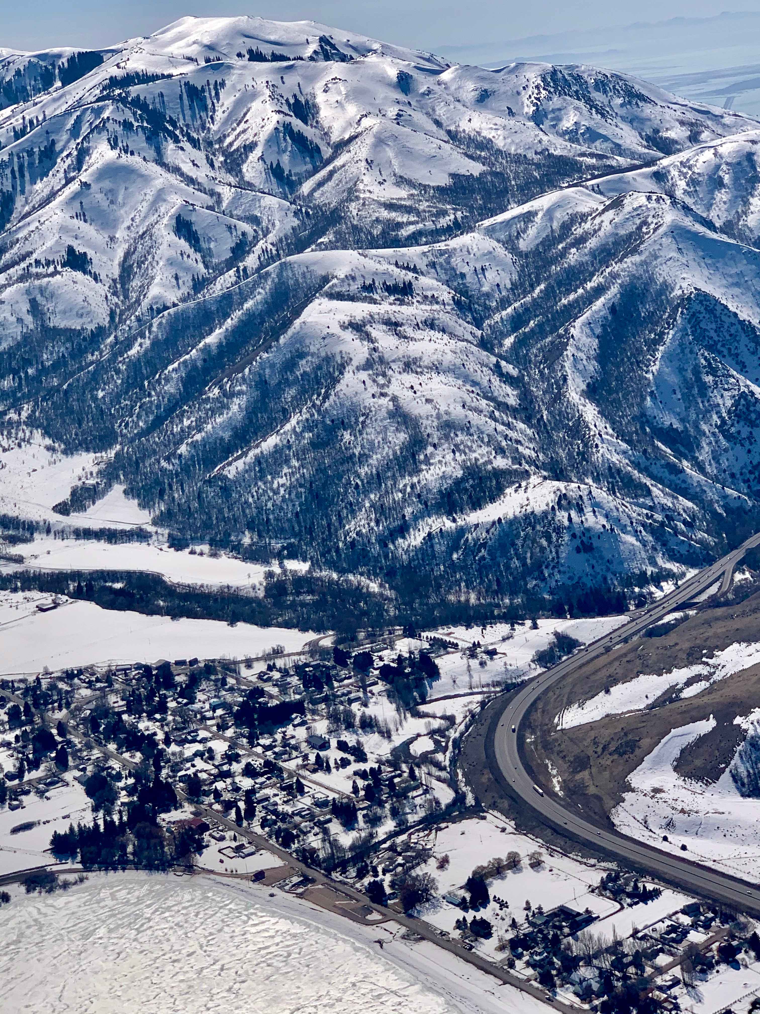 Arial view of Mantua and surrounding mountains. Rasmussen Ridge is the rectangular, snow-covered patch just left of center. Lake is lower left. 