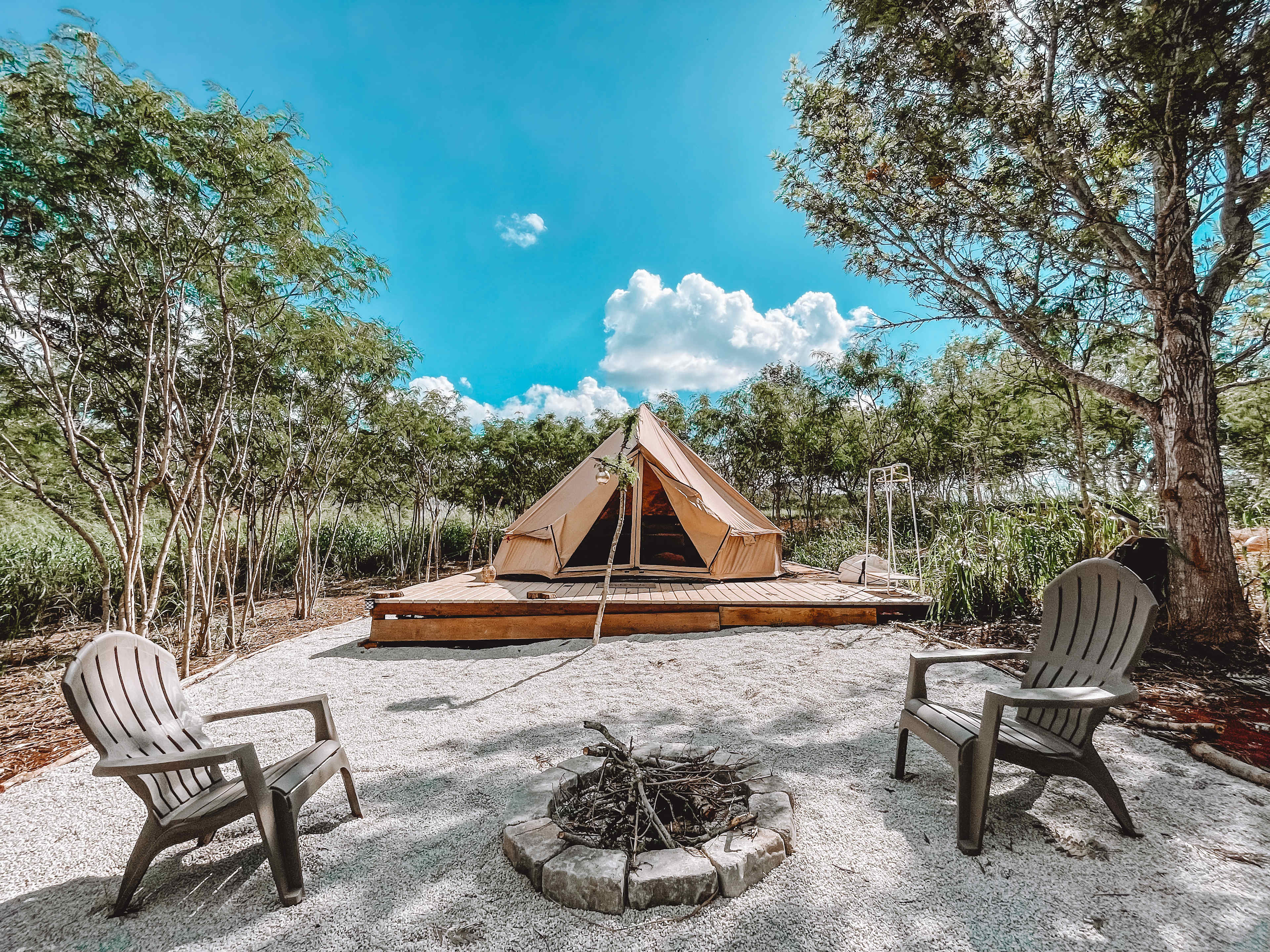 Chairs outside your tent. Unfortunately, we don’t allow open fires at this time for safety reasons. 