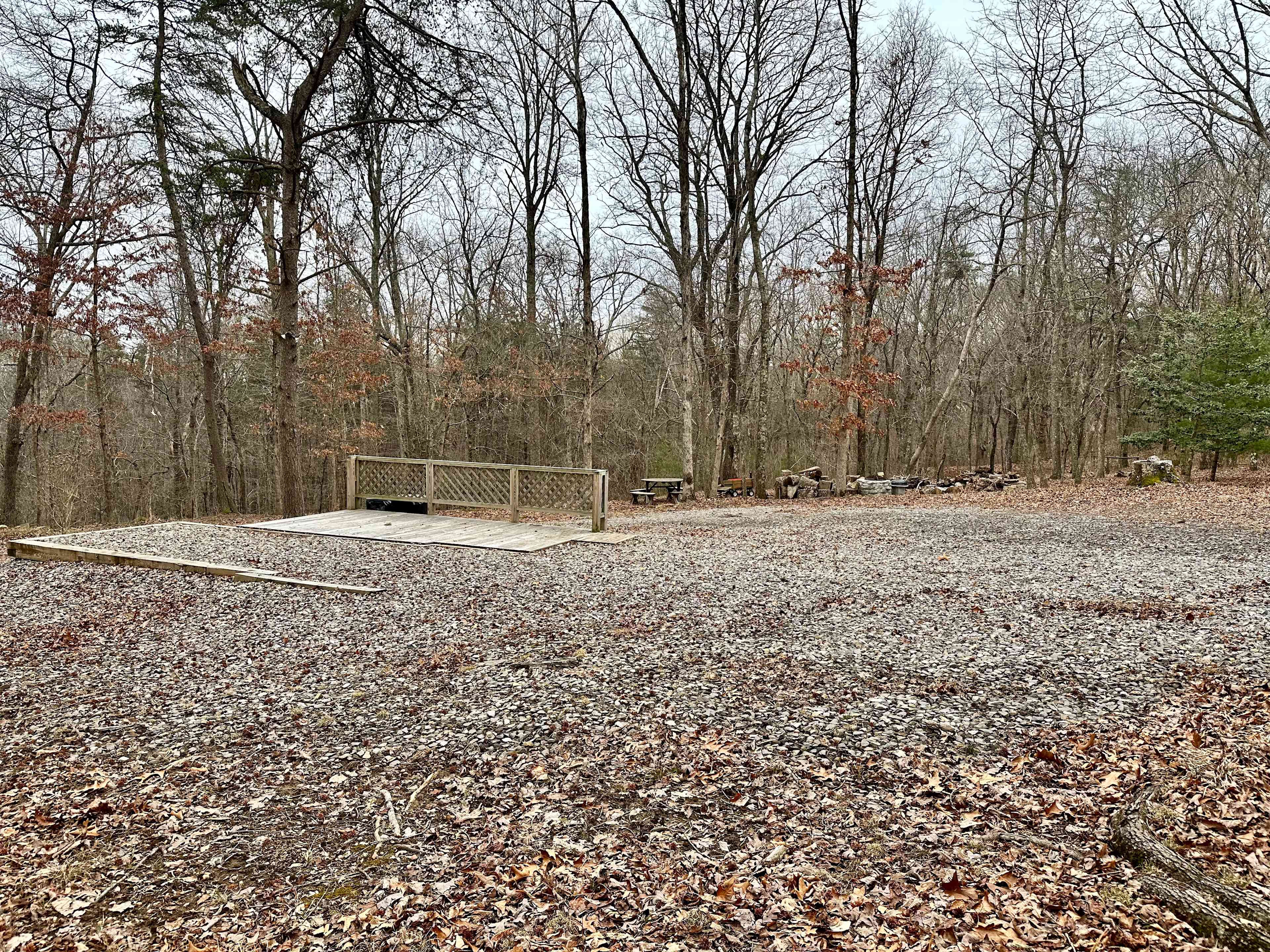 Gravel RV pad w/WiFi, full hookups (30 amp electric, septic, city water), trash bins, picnic table, fire pit, deck, and 8 acres to explore