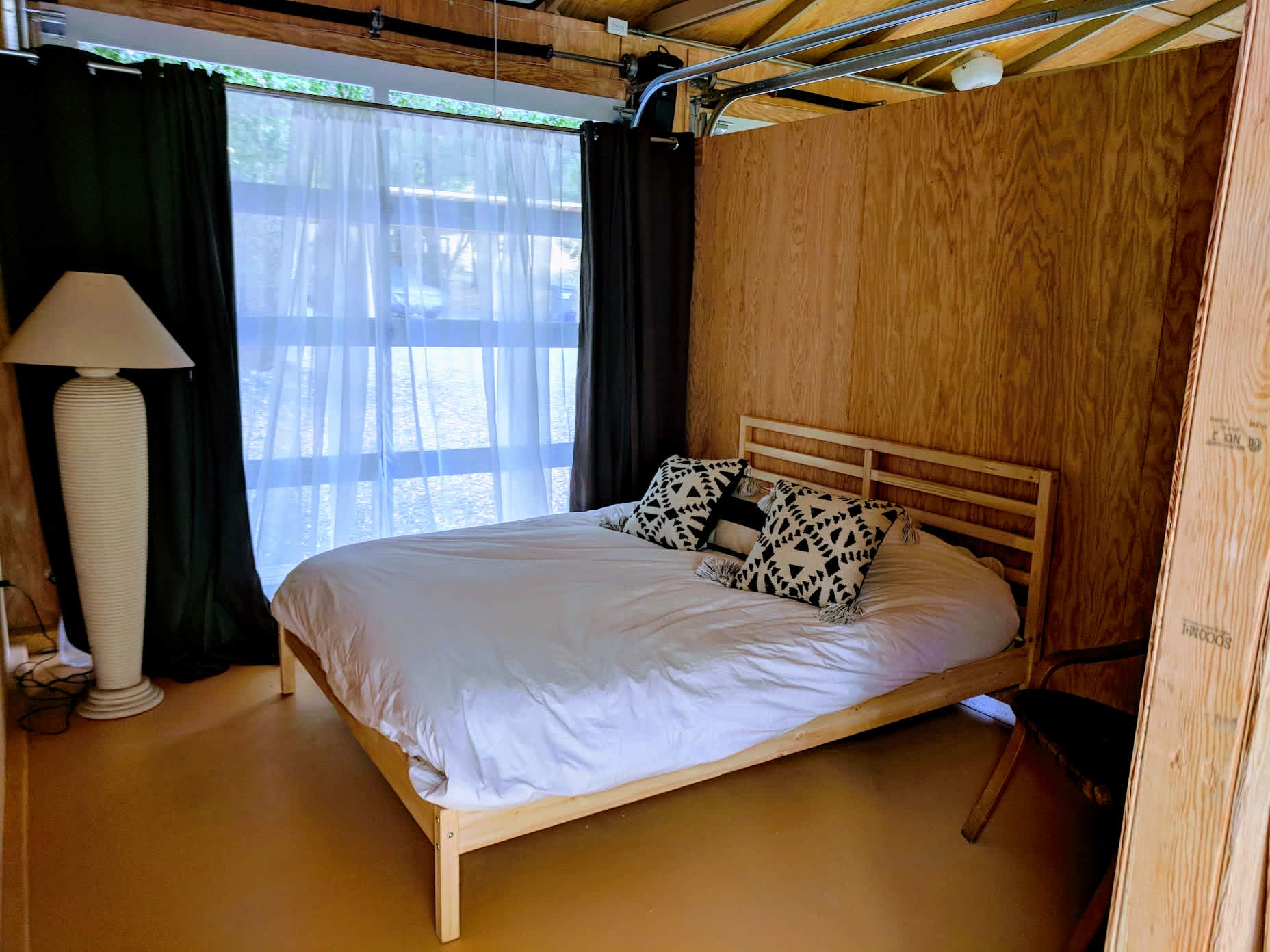 Queen sized bed. Curtains close for some darkness. 
