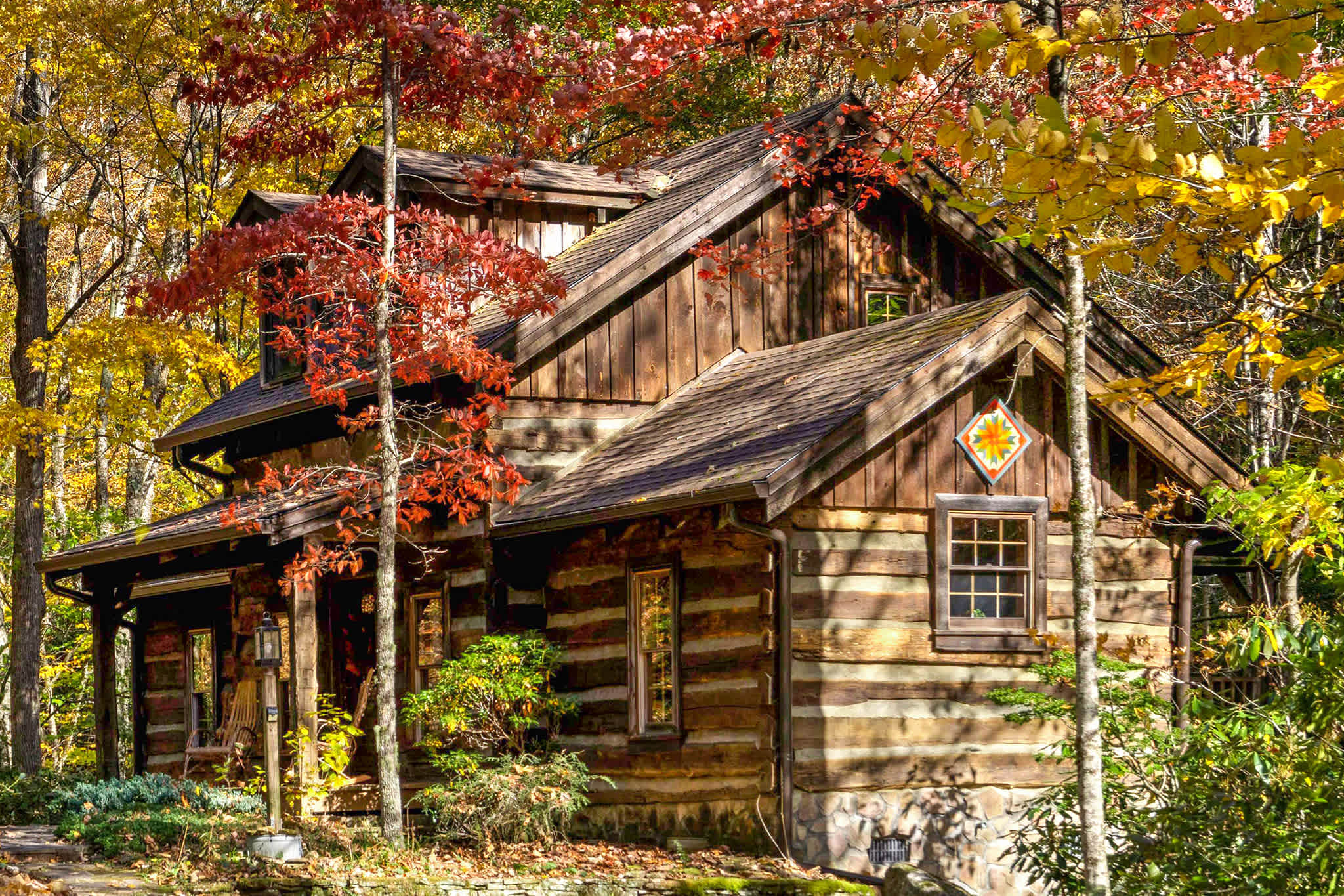 Comfy, cozy real log cabin! Secluded yet accessible off a state road with flat driveway, this log cabin is in a magical setting
