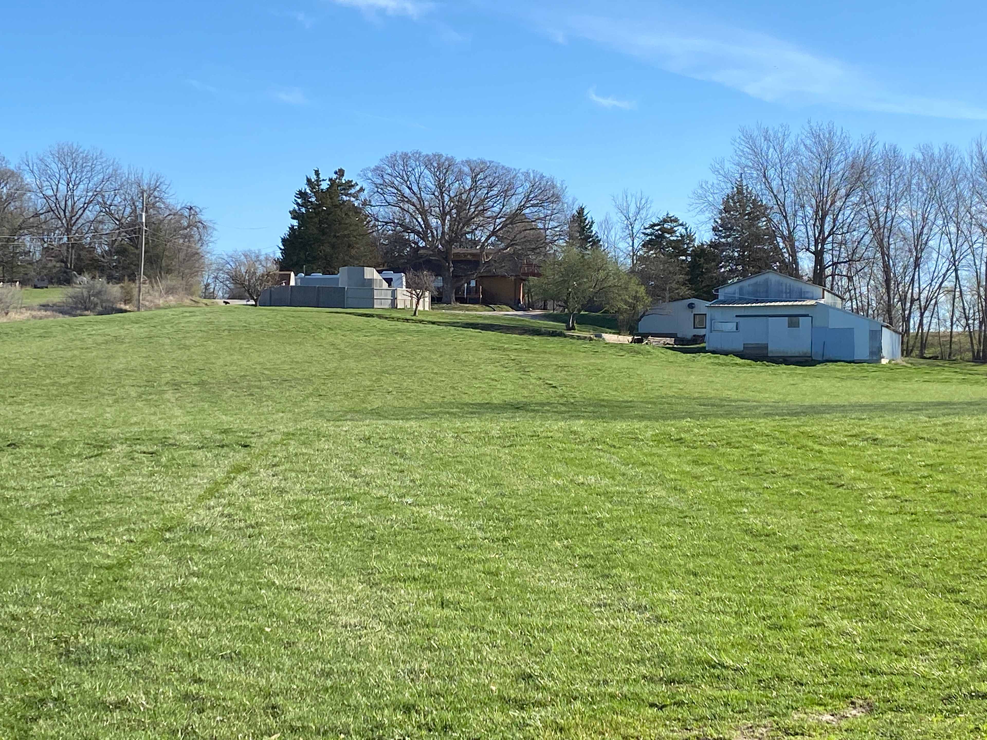 The view of our home, barn and pool area from the camping area.  Bonfires are welcome!
