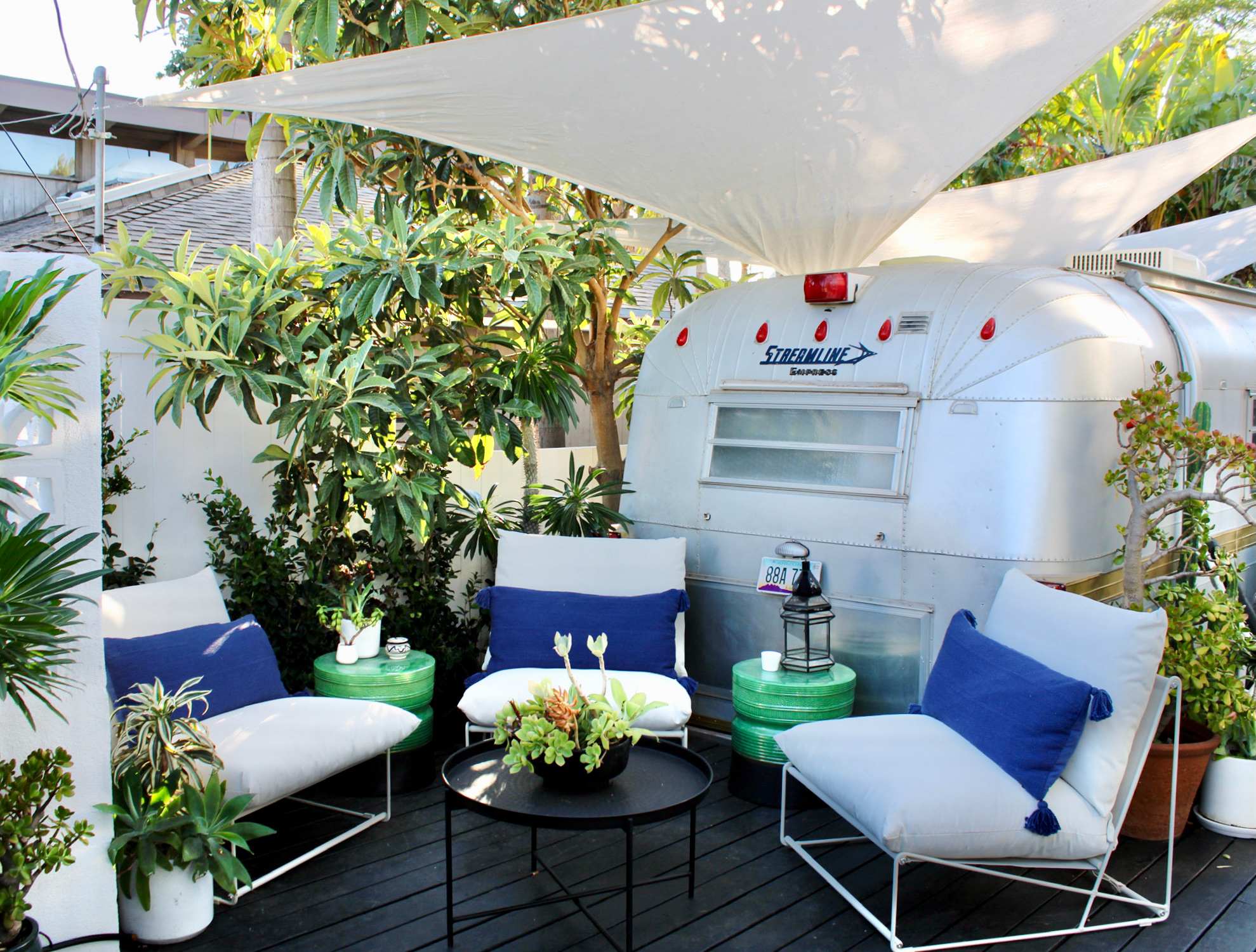 Enjoy a cocktail with a friend in this cozy outdoor seating area!