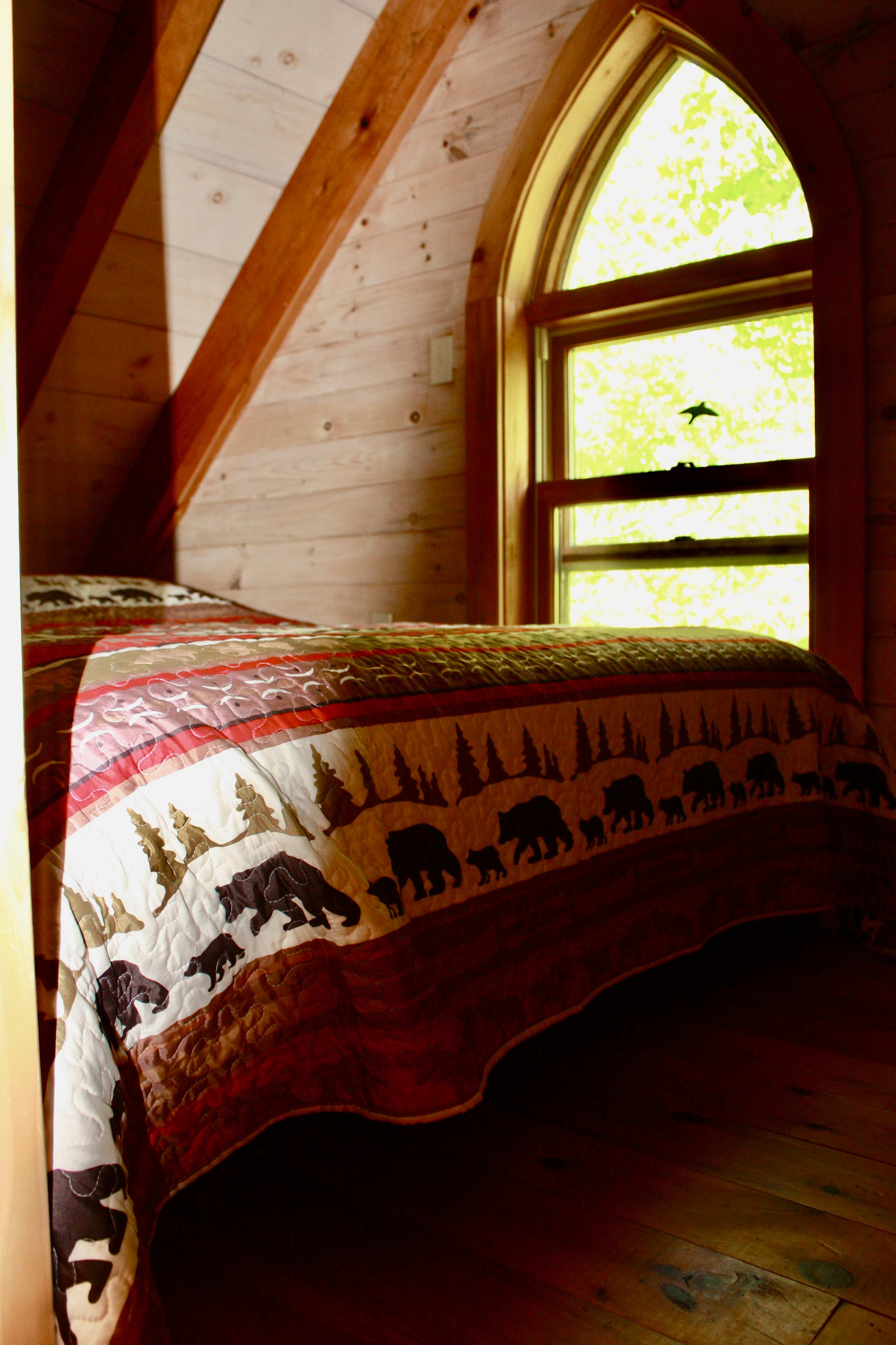 Queen size loft bed with amazing views of forested area