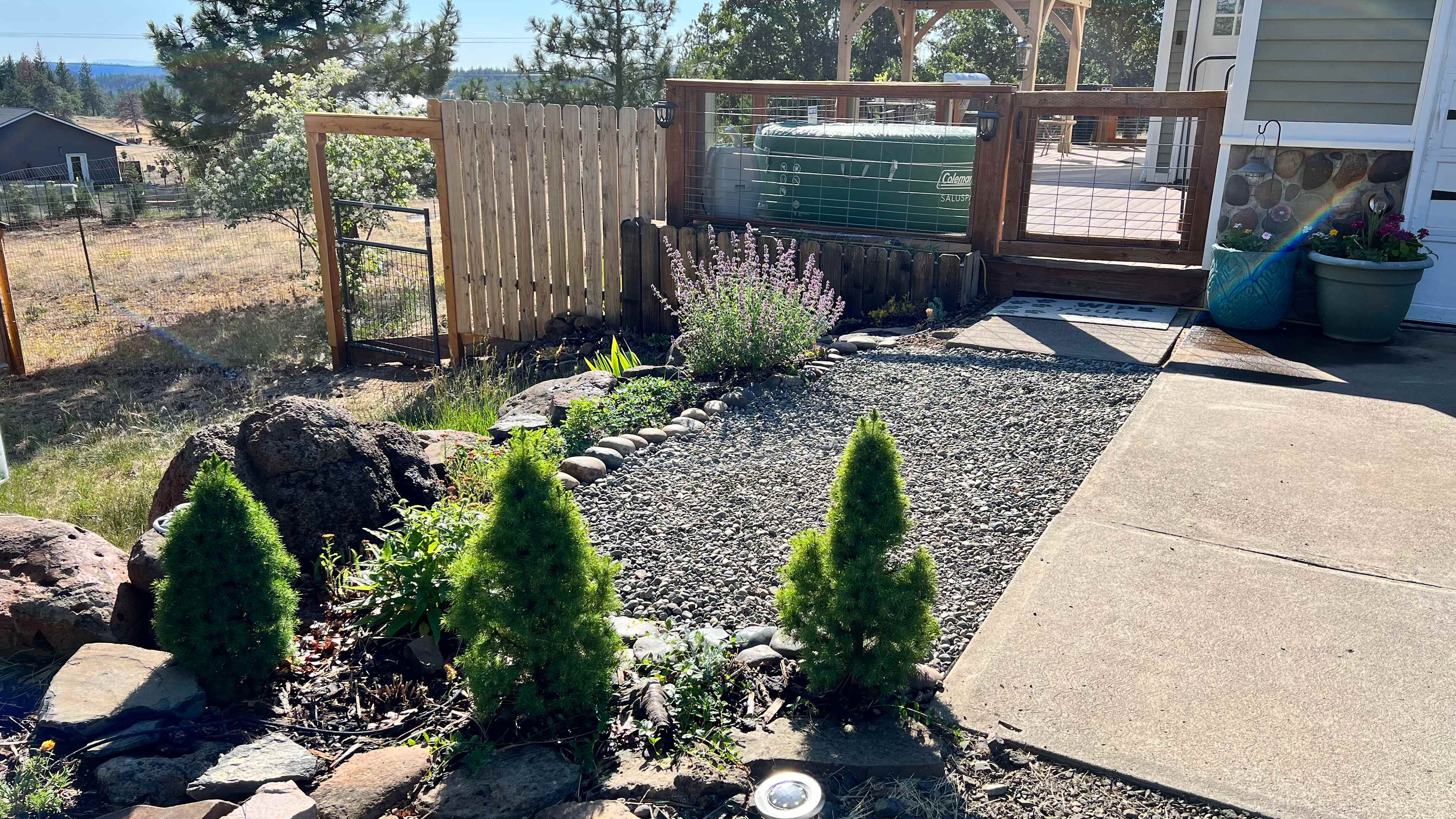 Front approach of the house; this is where you access the front pavilion, fire table, BBQ, and goats. :)

The house is also a bed and breakfast available on Airbnb (Woodland Escape). 