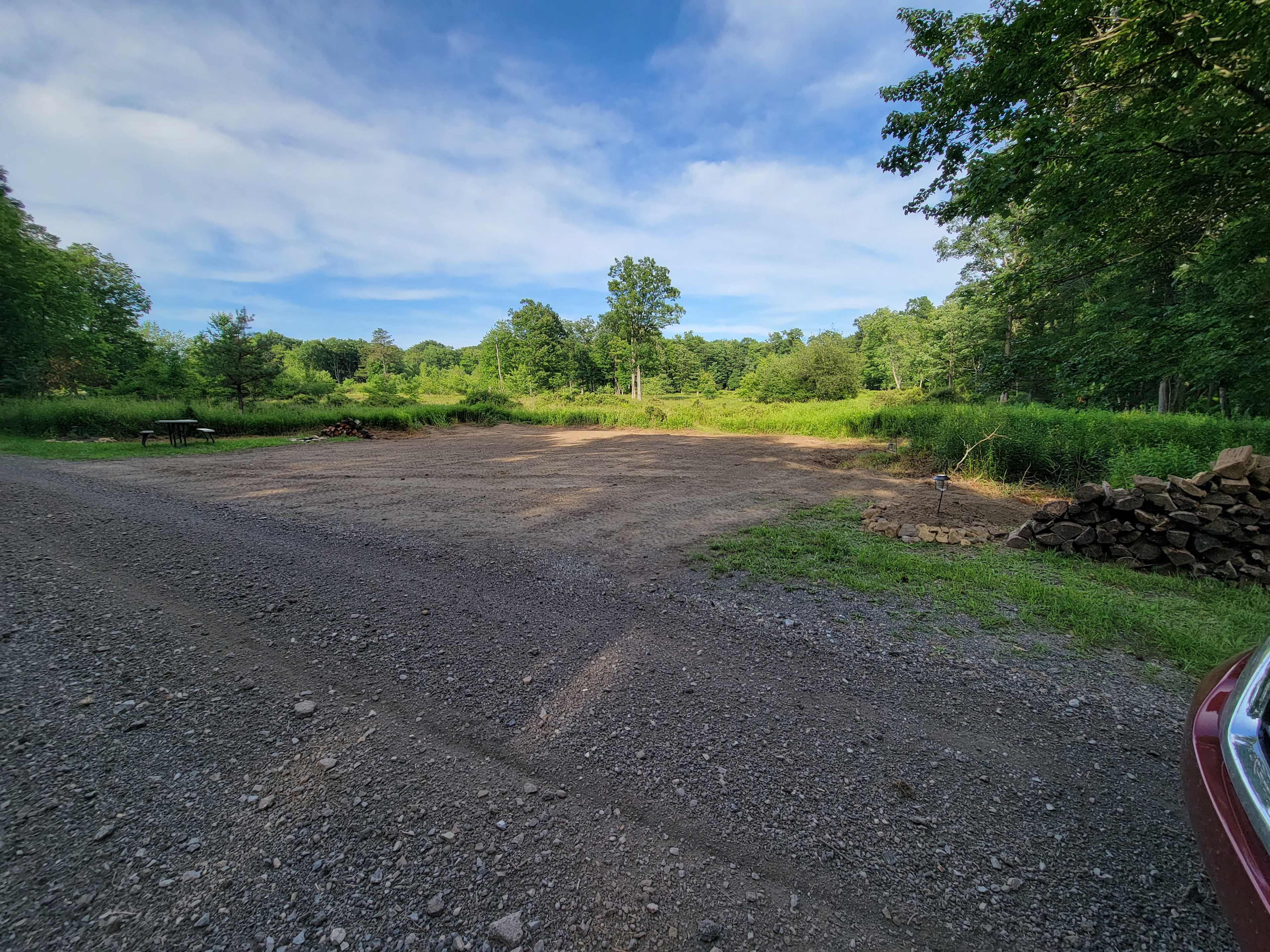 Camping area is 50x40, with driveway in front of site. Plenty of space!