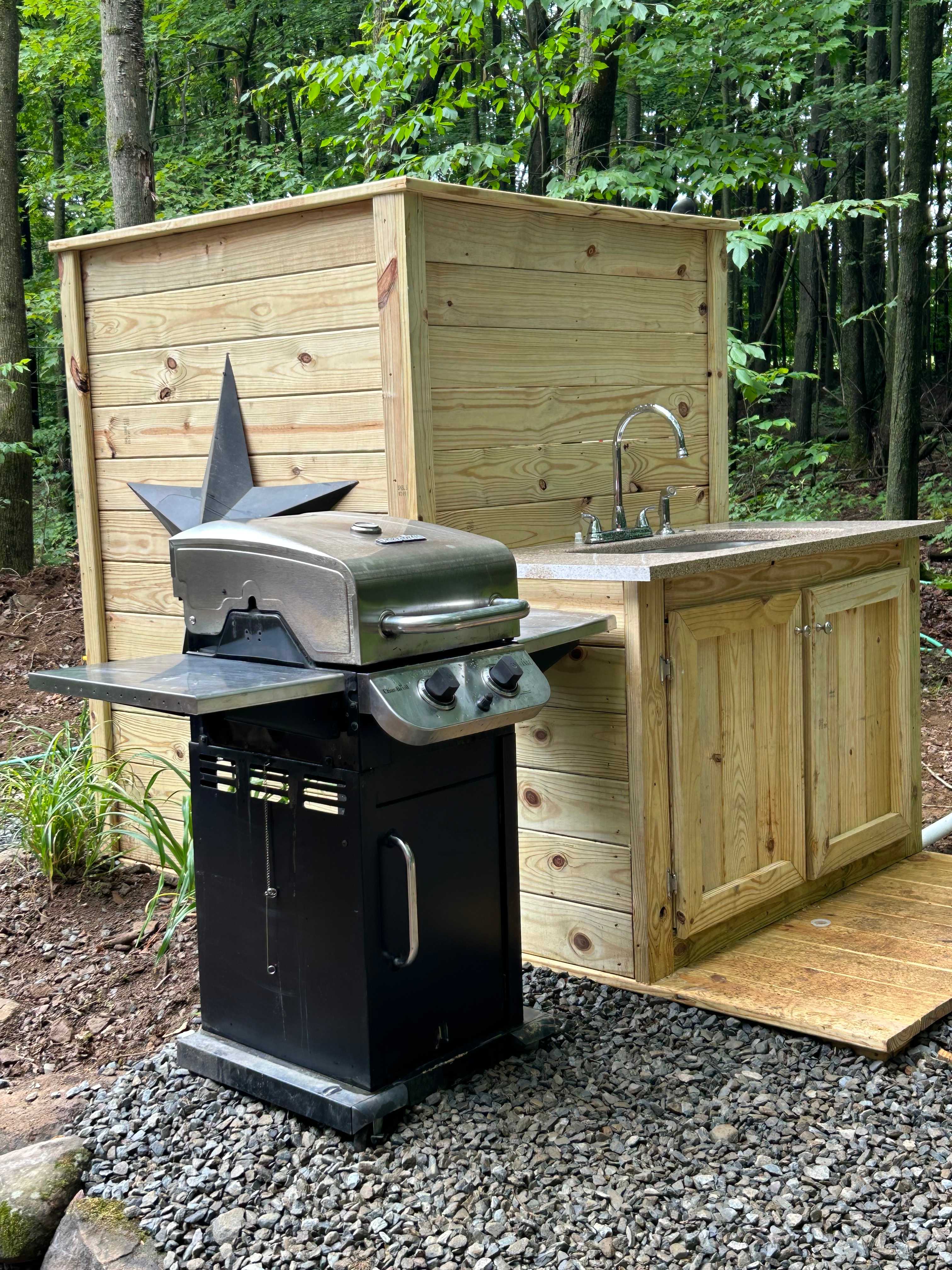 Outdoor kitchen and shower with hot water!