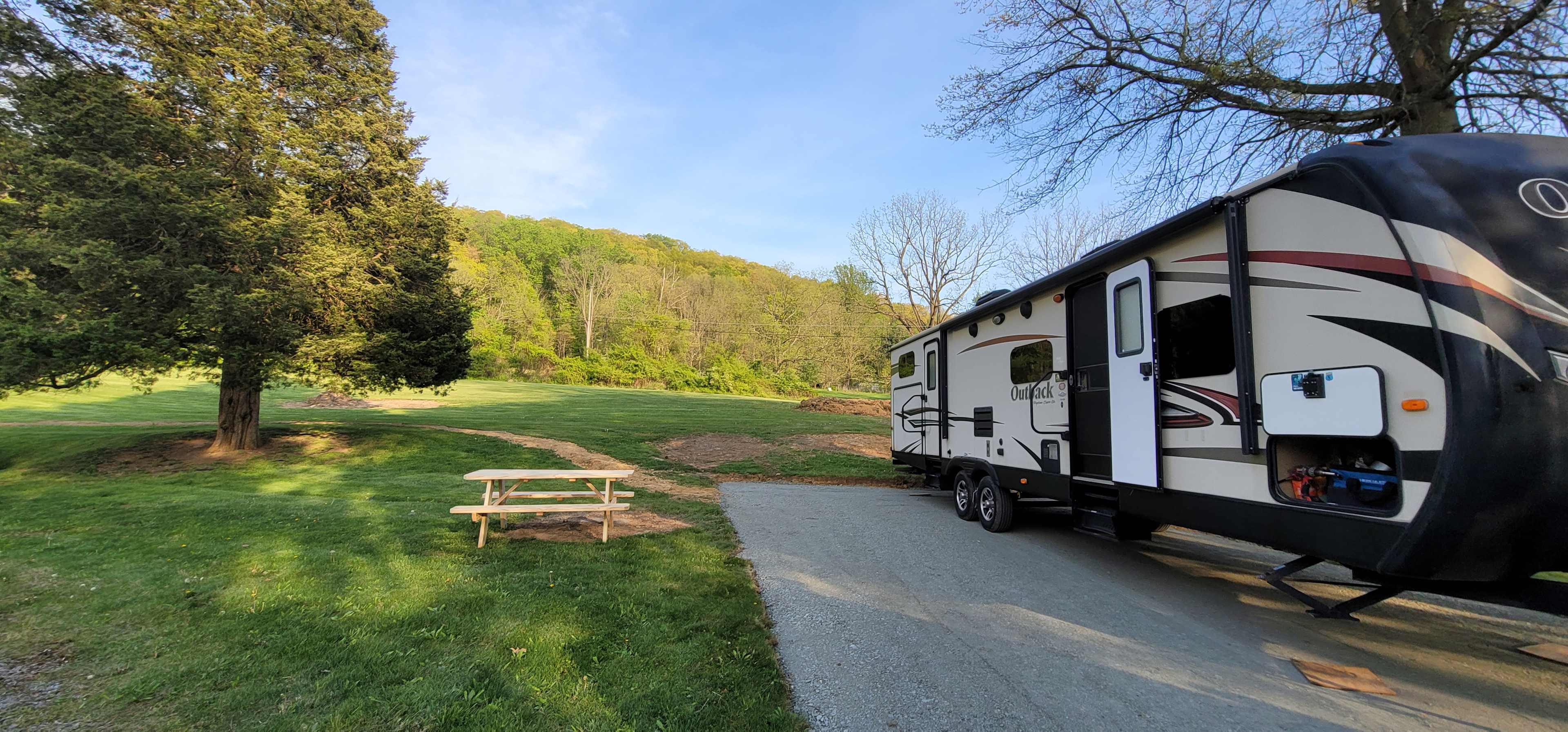 Outside Area, Fire pit ring is to the left of the picnic table. 
