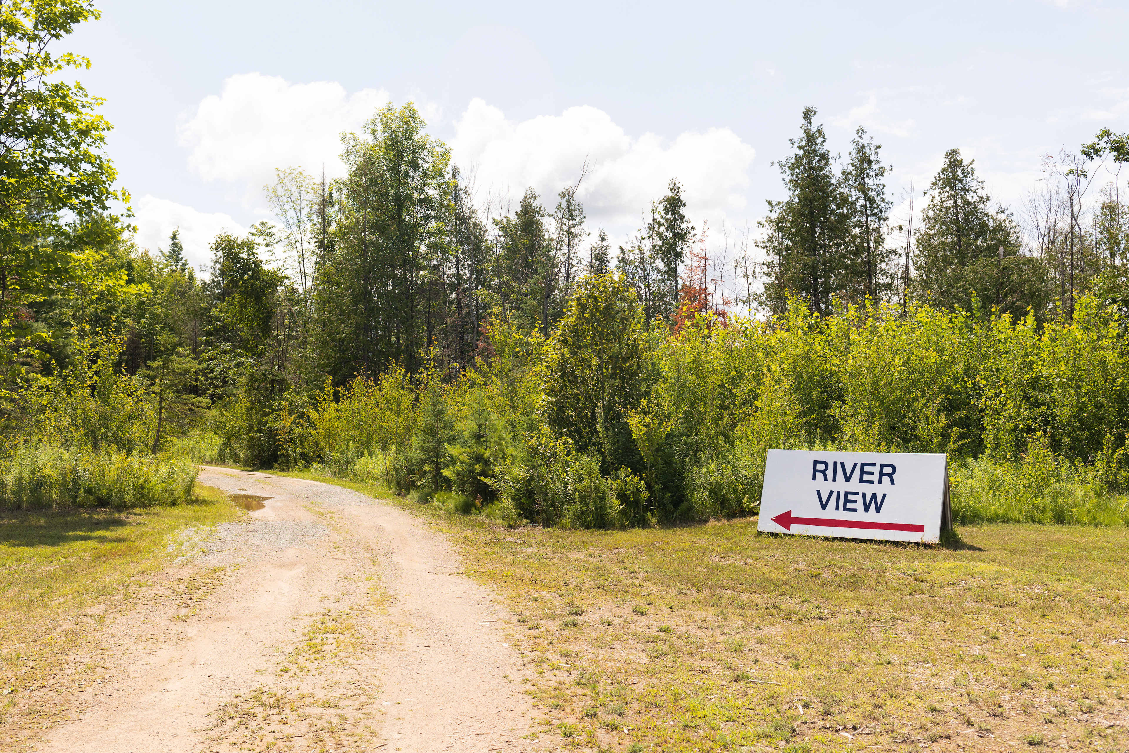 You’ll see this sign after pulling into the business site and drive straight pst the building along the dirt road