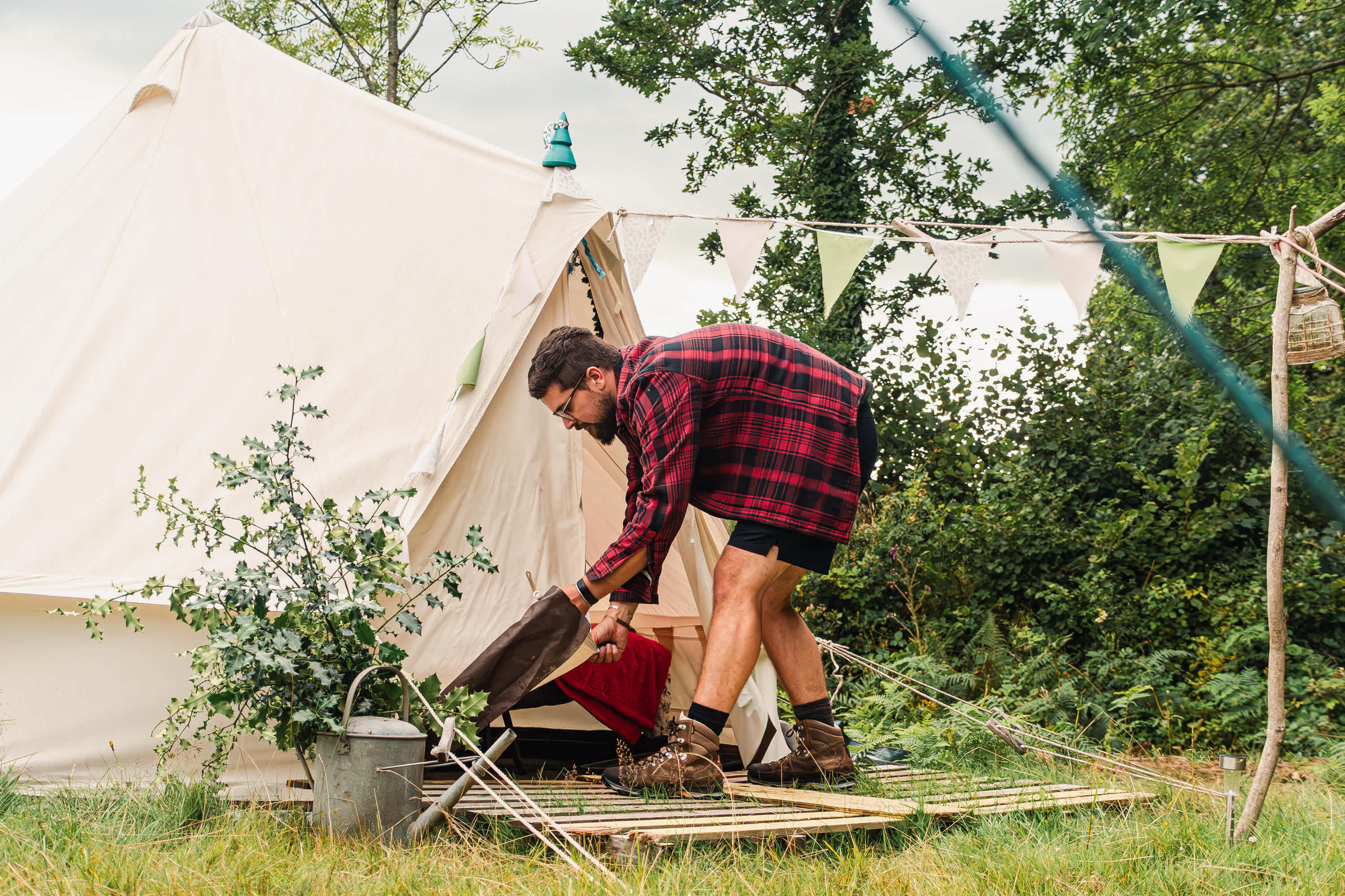 Rolling up the tent entrance on Holly Bush