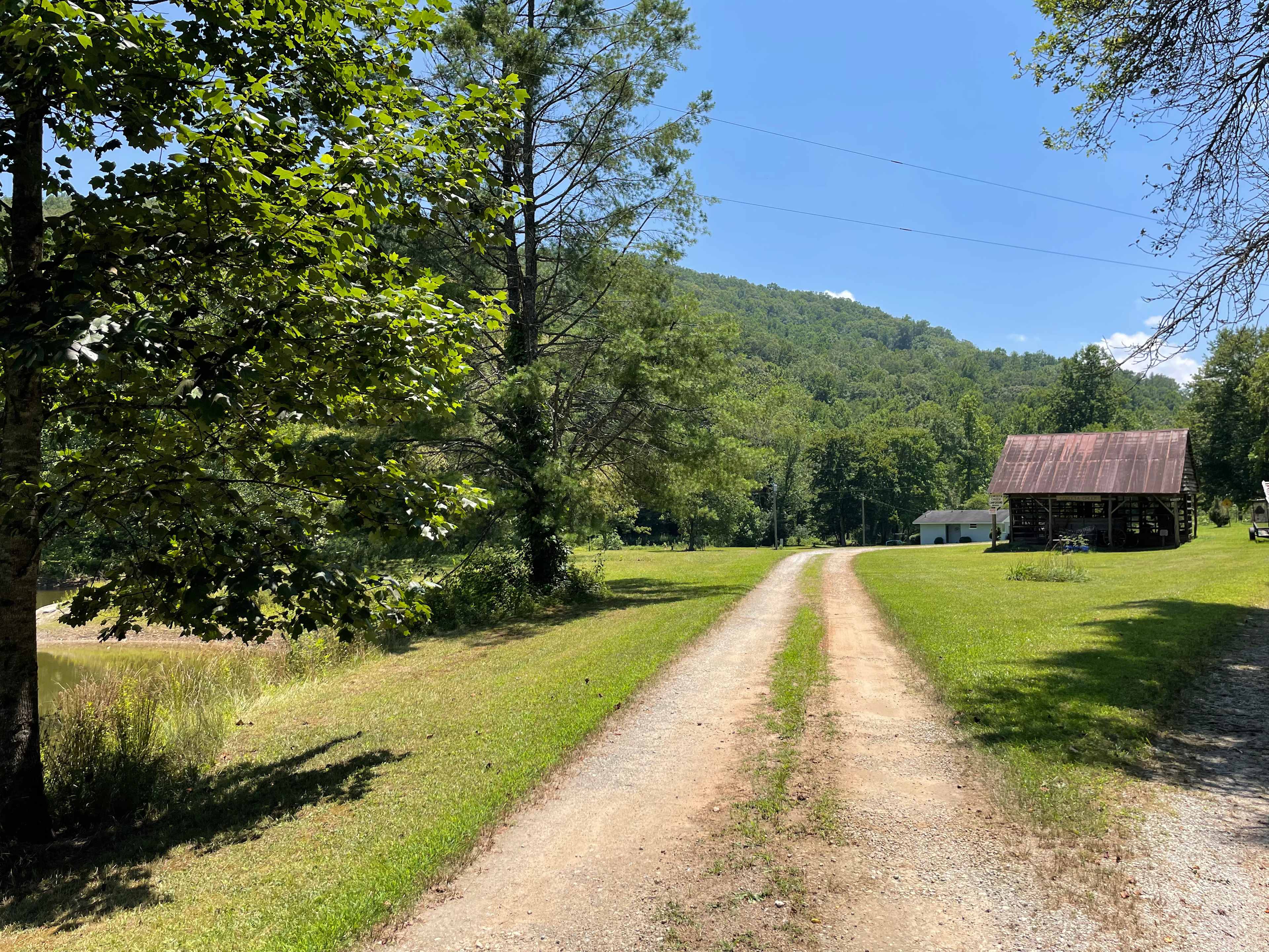 This is the Campground road leading to our property.  Past the corn crib and pond is where the property begins.