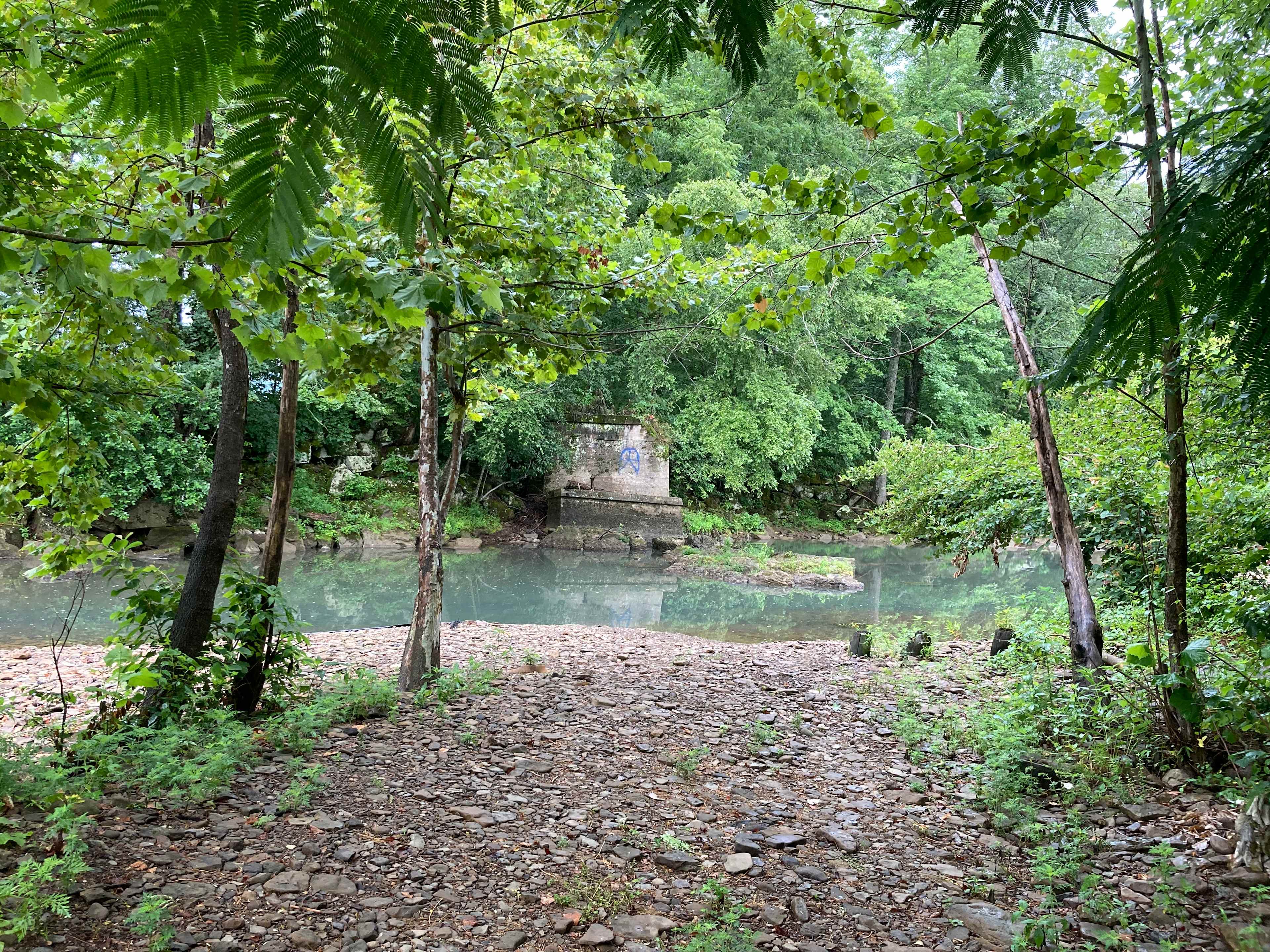 Remains of old railroad bridge below the main bridge on the highway coming into town.