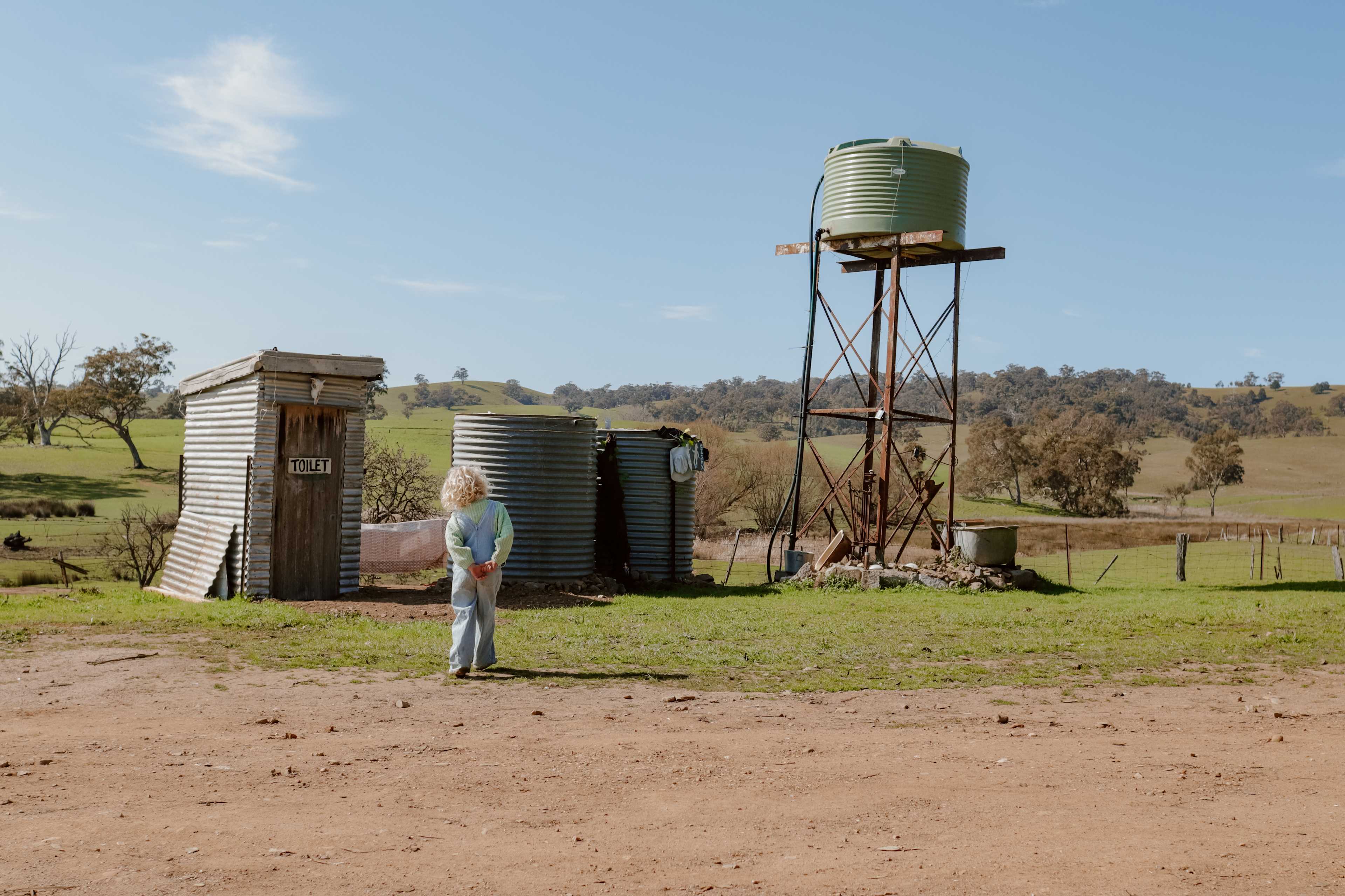 Outdoor showers and flushing toilet.